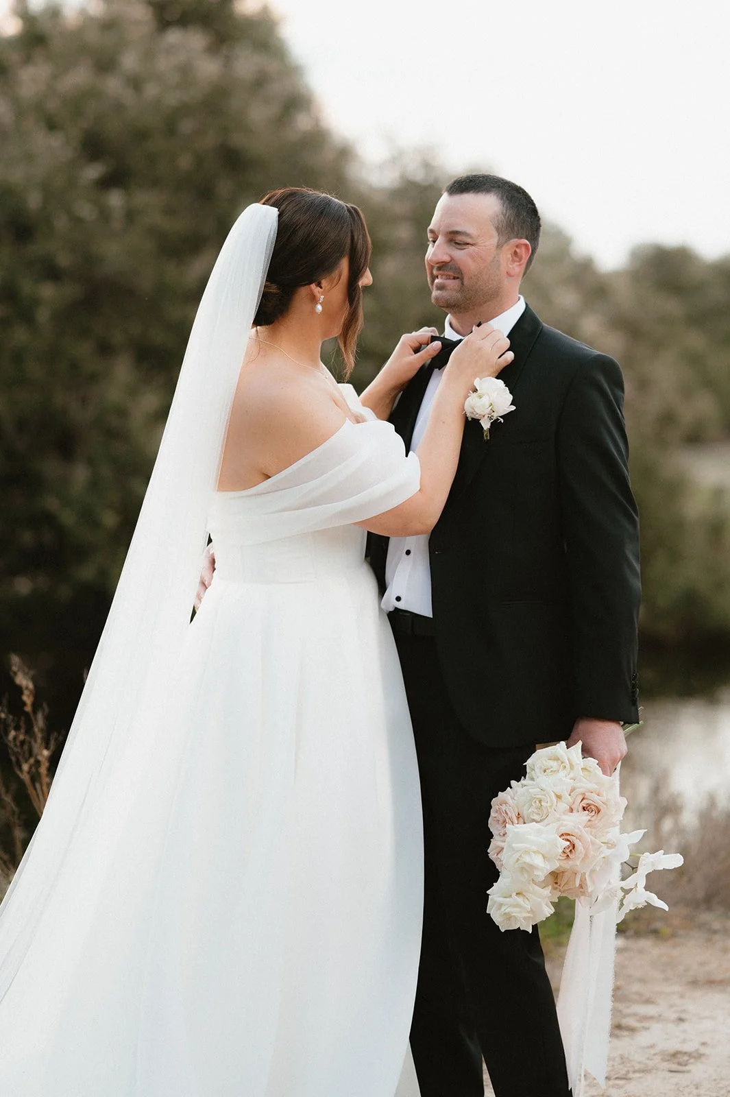 Danielle & Mitch on their wedding day, South Coast, Western Australia.

Wearing her custom heirloom wedding veil. Featuring her mother's bridal veil's embroidery and modern pearls.

Taylah Jayde Photography 