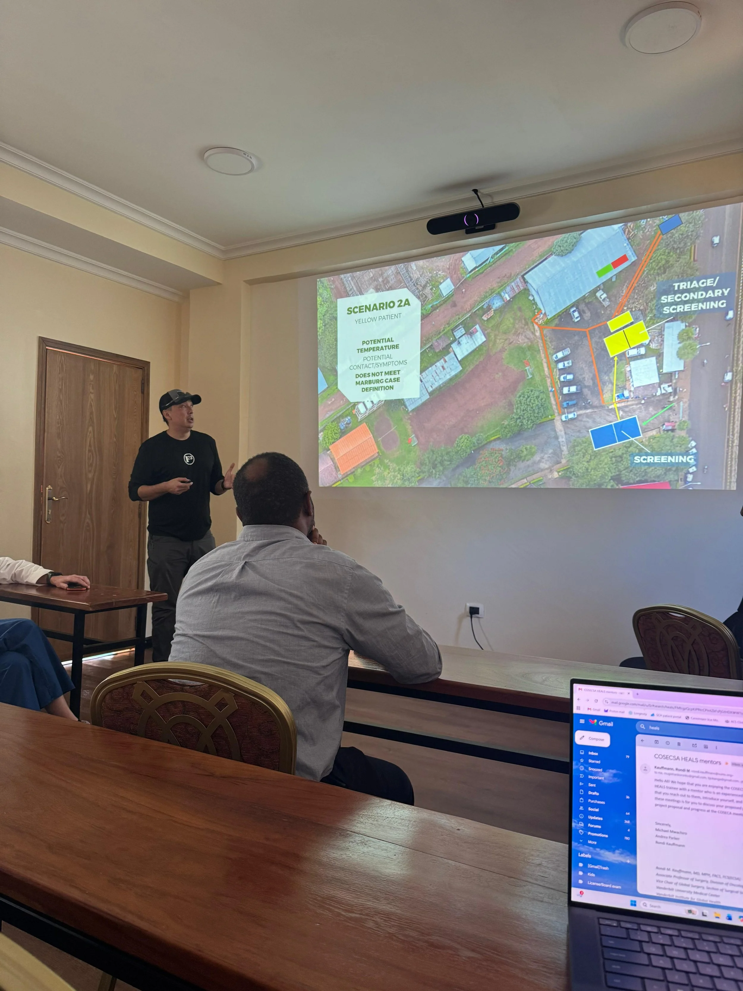 Luis presenting our new triage plan to the CEO and the hospital's Marburg Response Team