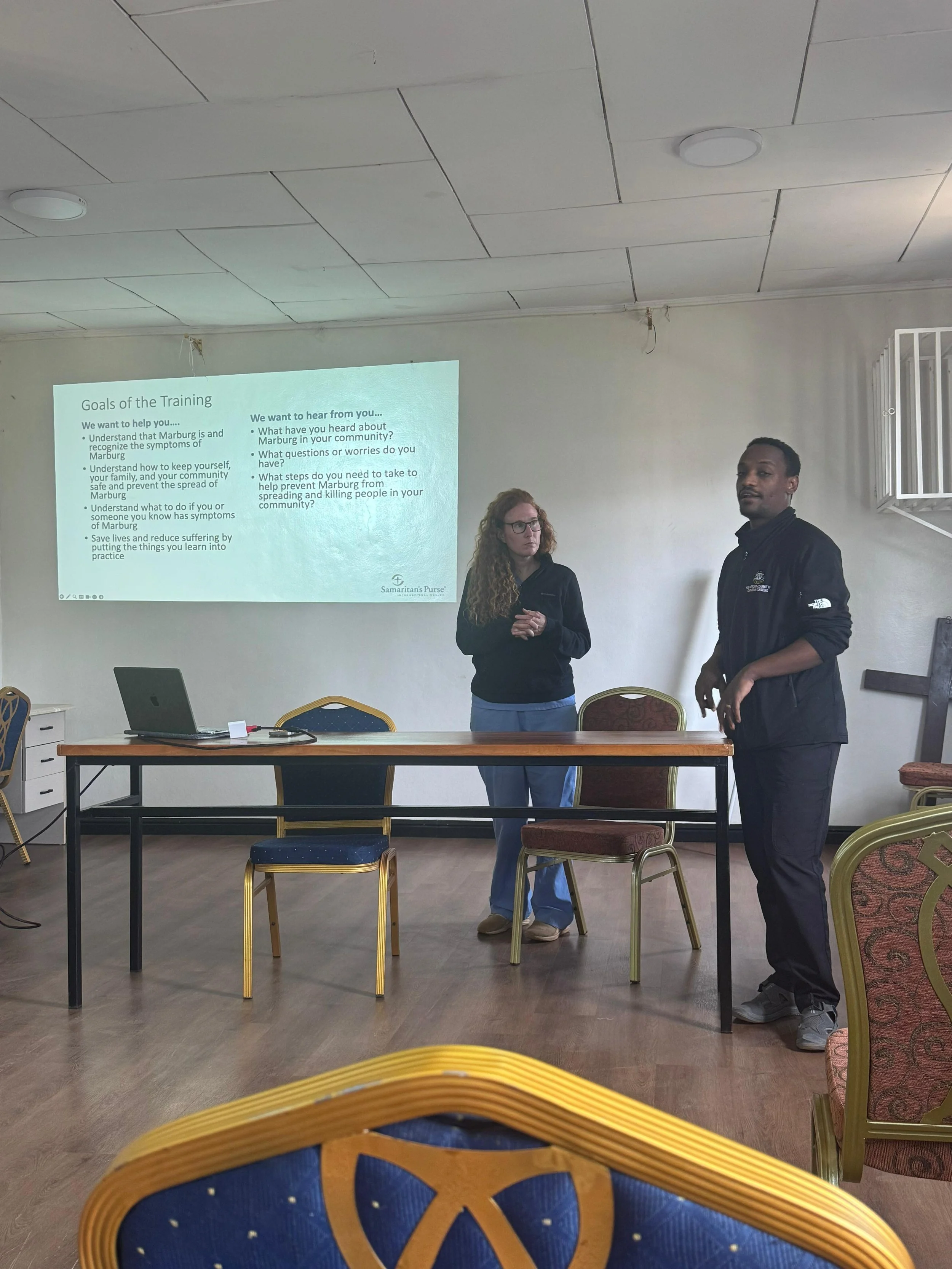 Our friend Joy and one of my residents, Getiso, giving one of our staff trainings on Marburg