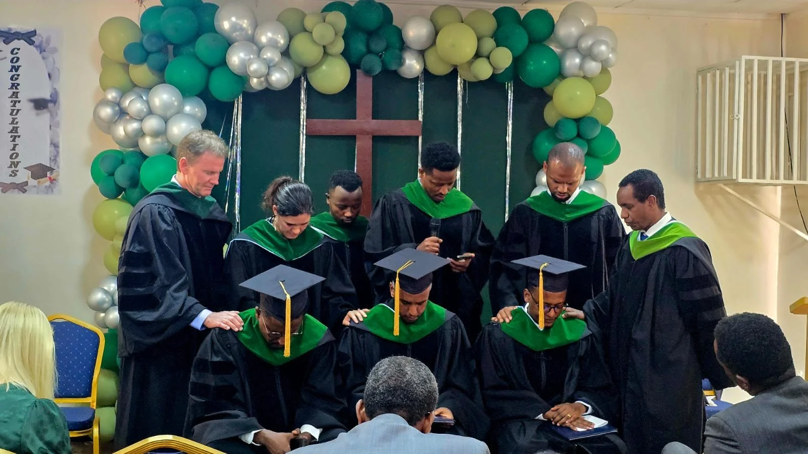 Surgical Faculty Praying Over Our Graduates