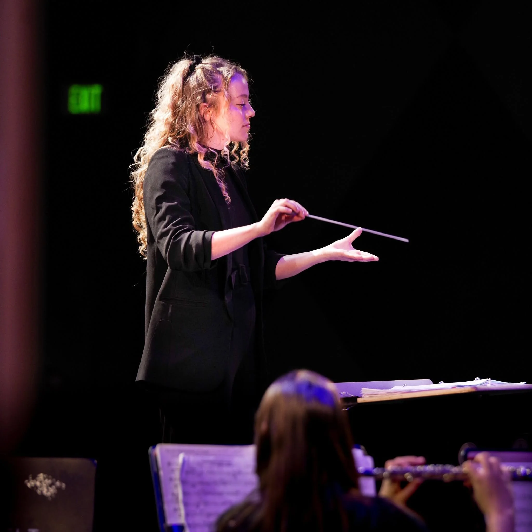 Photo of Hannah Mowry conducting