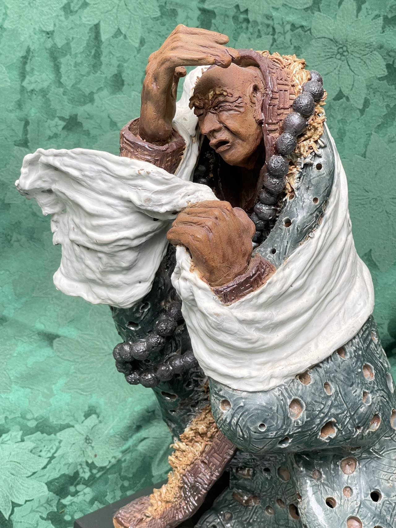 A closer view on the details of Gary Liscum's sculpture called "The Answer is Blowing in the Wind"