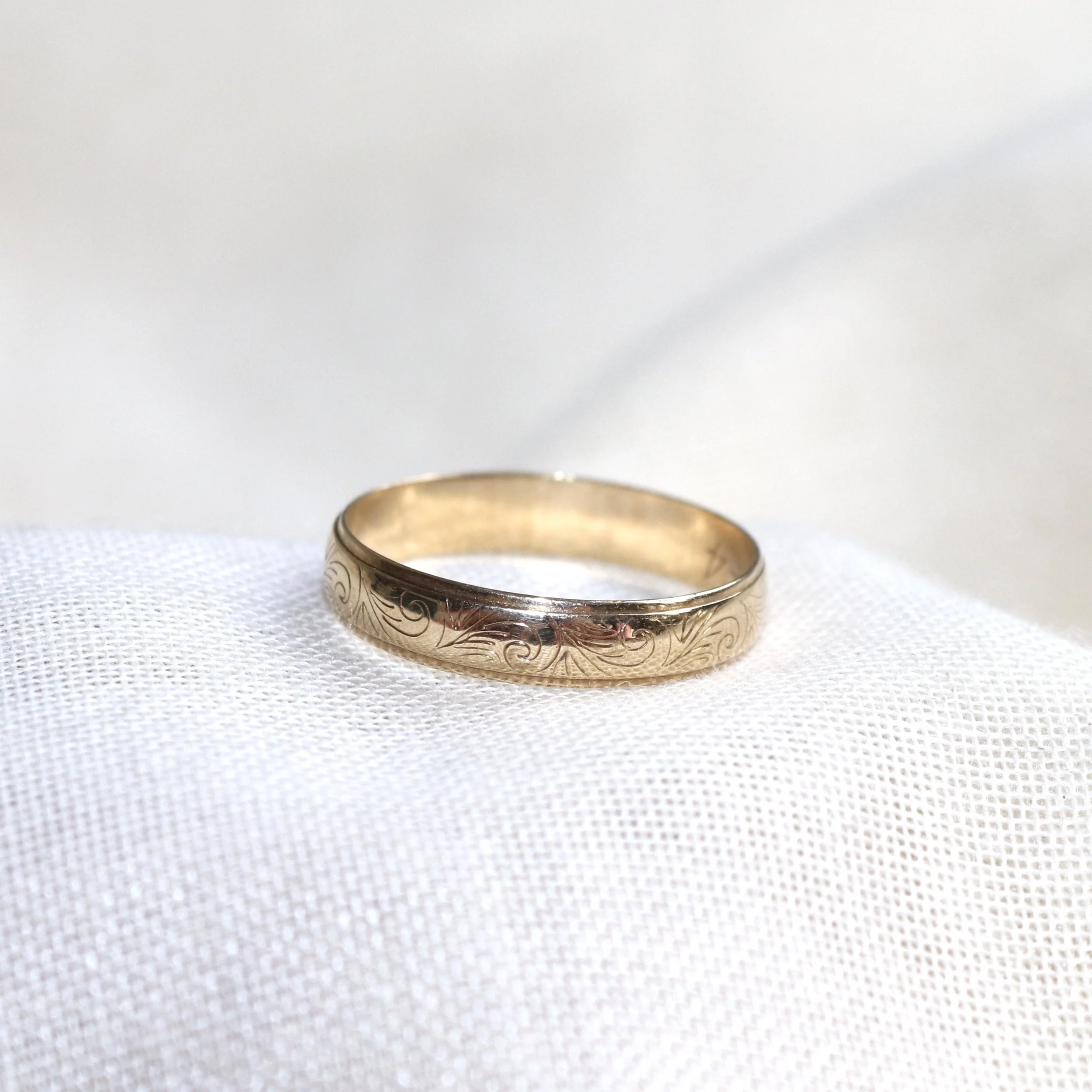 yellow gold engraved wedding band.jpg
