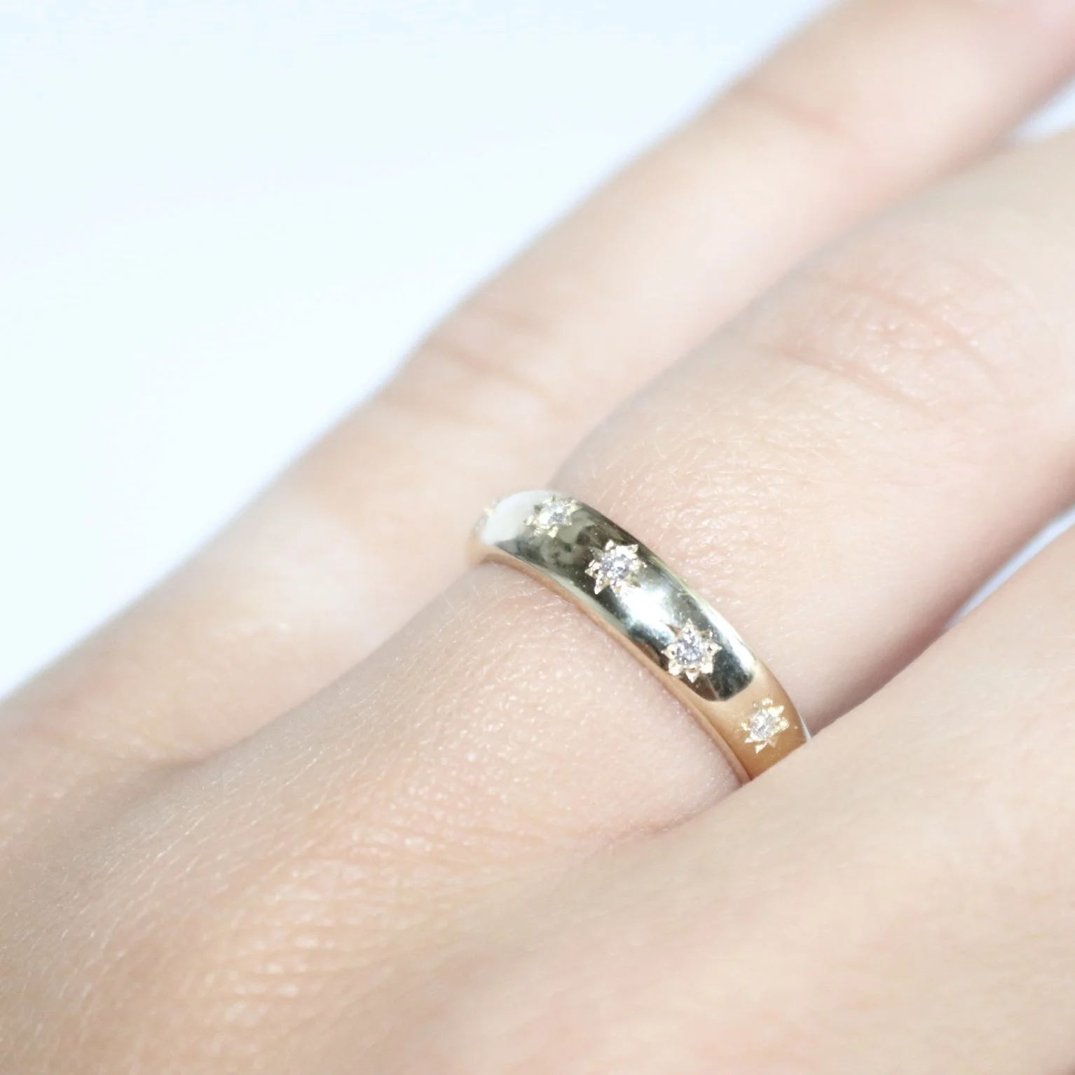 yellow gold star wedding ring.jpg
