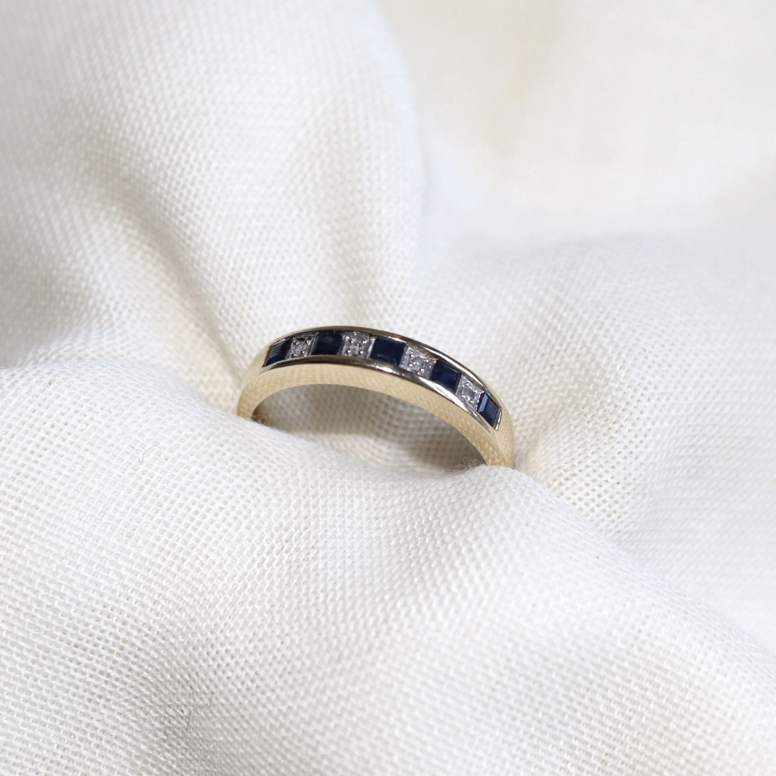 sapphire and diamond yellow gold band.jpg