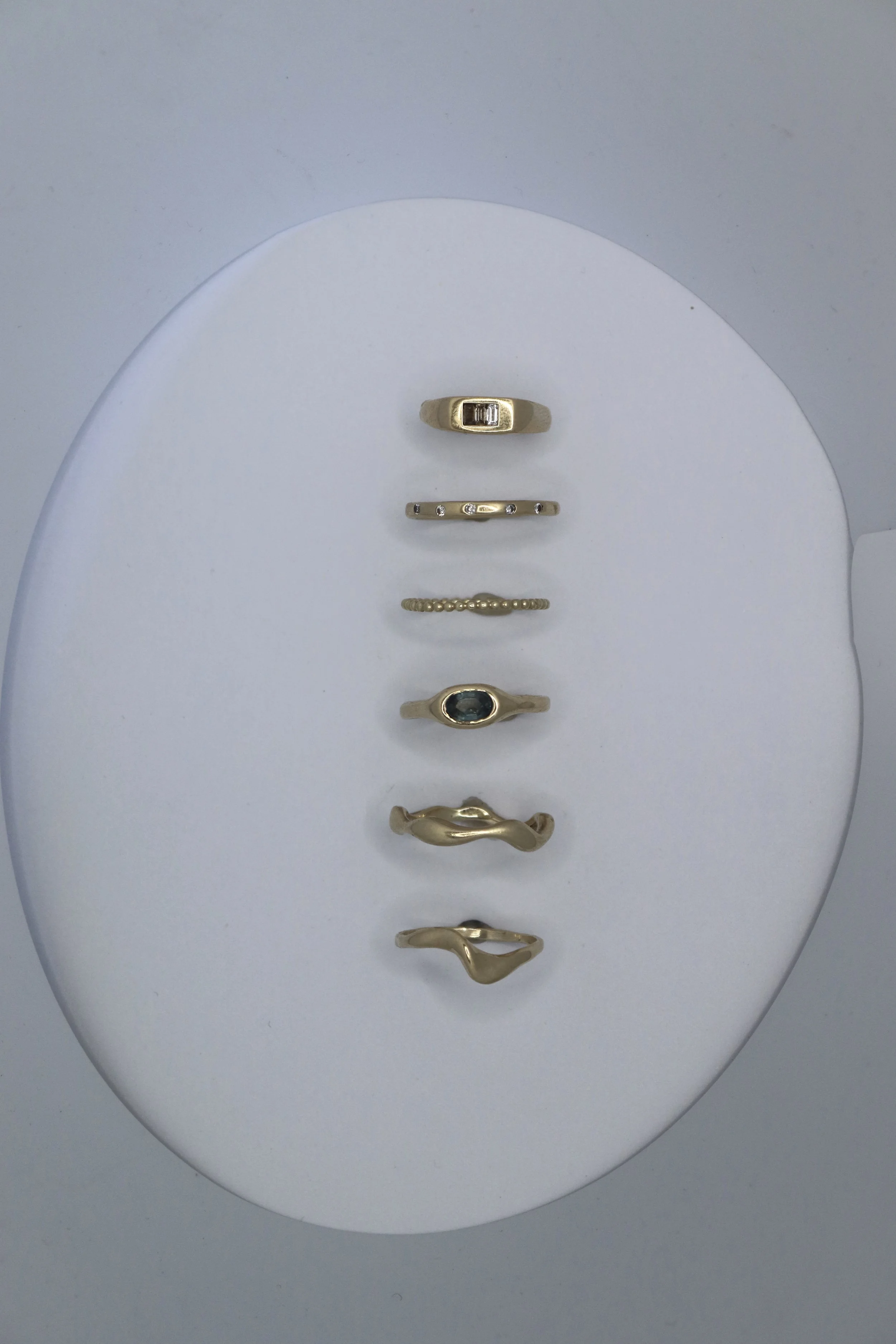 Solid gold rings set with sapphires and diamonds. Bespoke made rings.