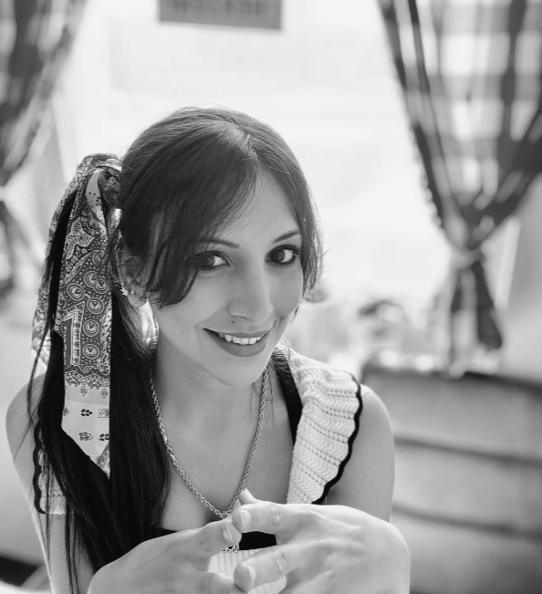 Black and white portrait of artist Mayssam, founder of mKunstraum, a Germany-based creator of handmade art and jewelry