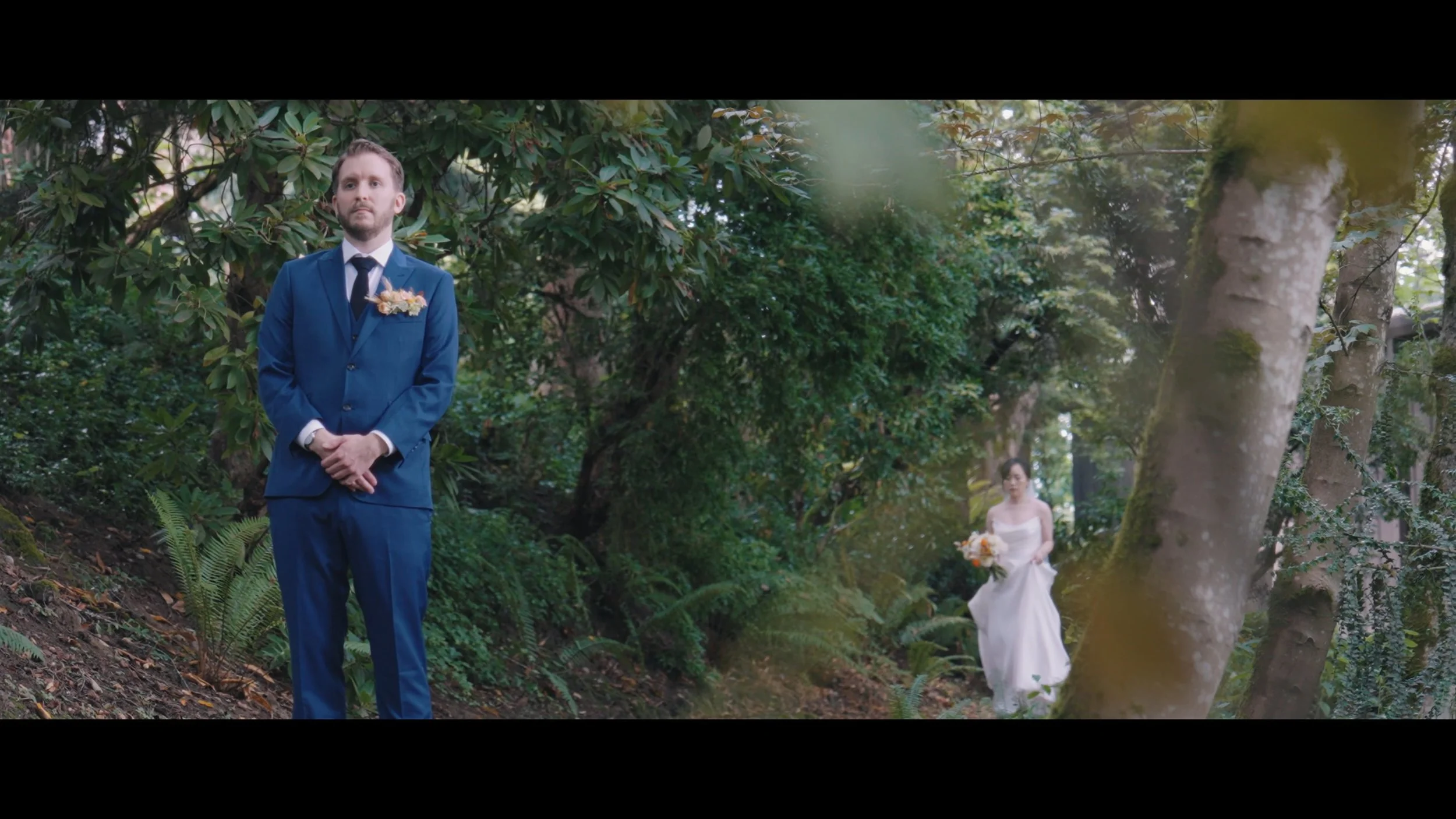Bride and groom first look in the wooded hillside at JM Cellars, Woodinville WA — Everseed Visuals