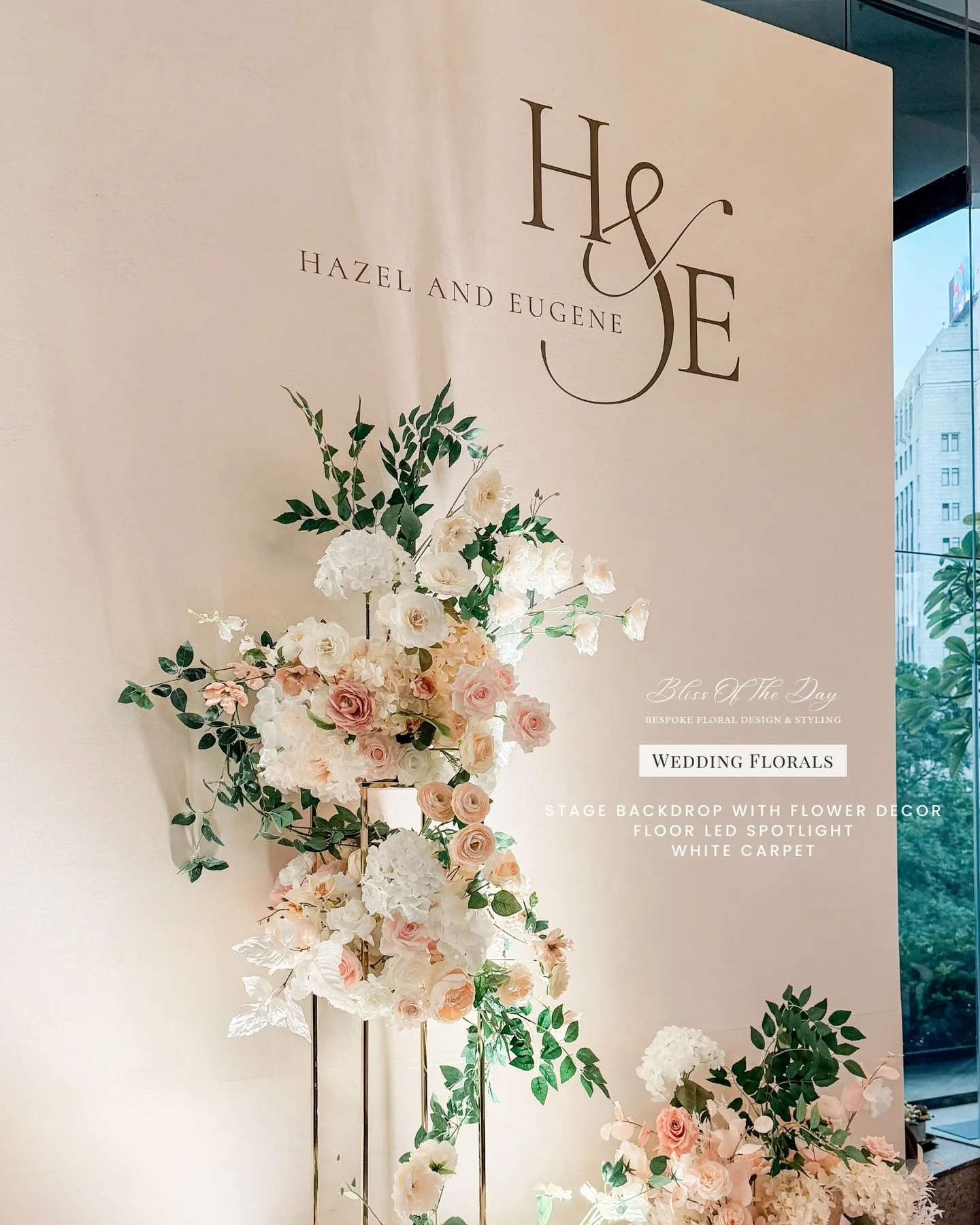 Wedding of Hazel &amp; Eugene 

Wedding styling at The Hong Kong Club, featuring a custom stage backdrop layered with floral installations, floor florals paired with LED spotlighting, and a clean white carpet to frame the space.

The setup extended a