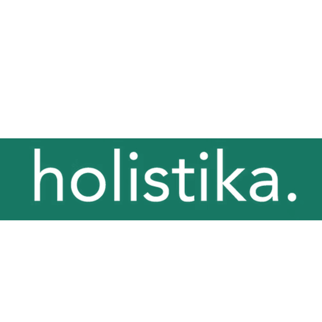Brown circular object with holes and the text 'holistika' in the center.