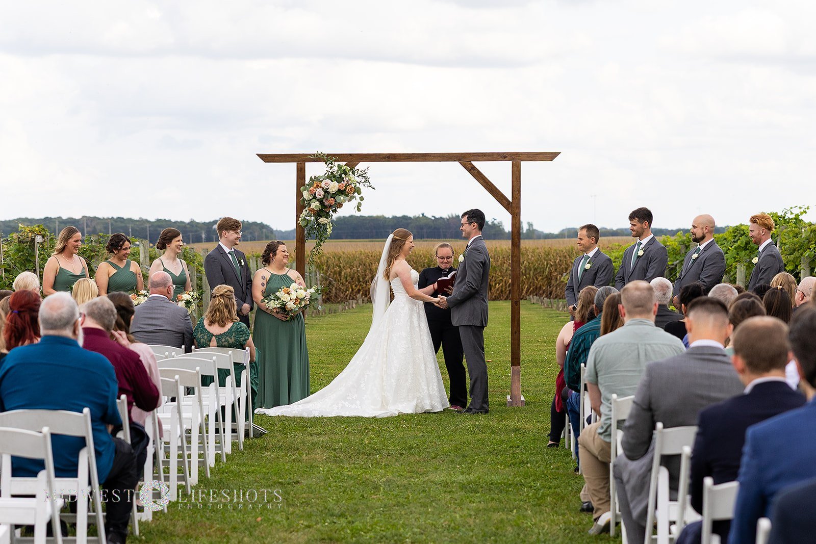 Quiet luxury - subtle statement florals on an arch at Four Daughter's Winery
