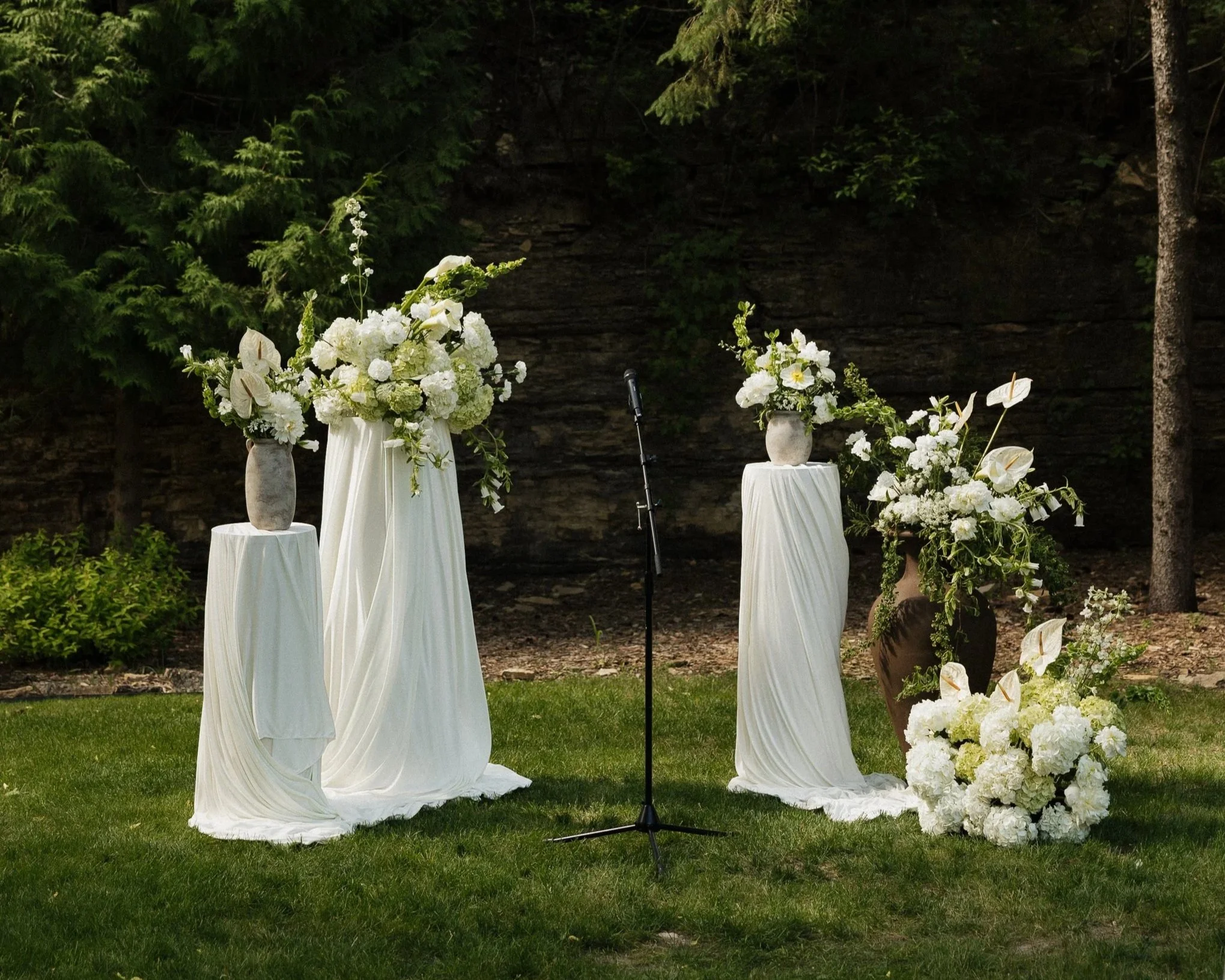 Potted garden ceremony wedding florals on pillars draped with organza cloth | Hilltop House, Rochester, MN