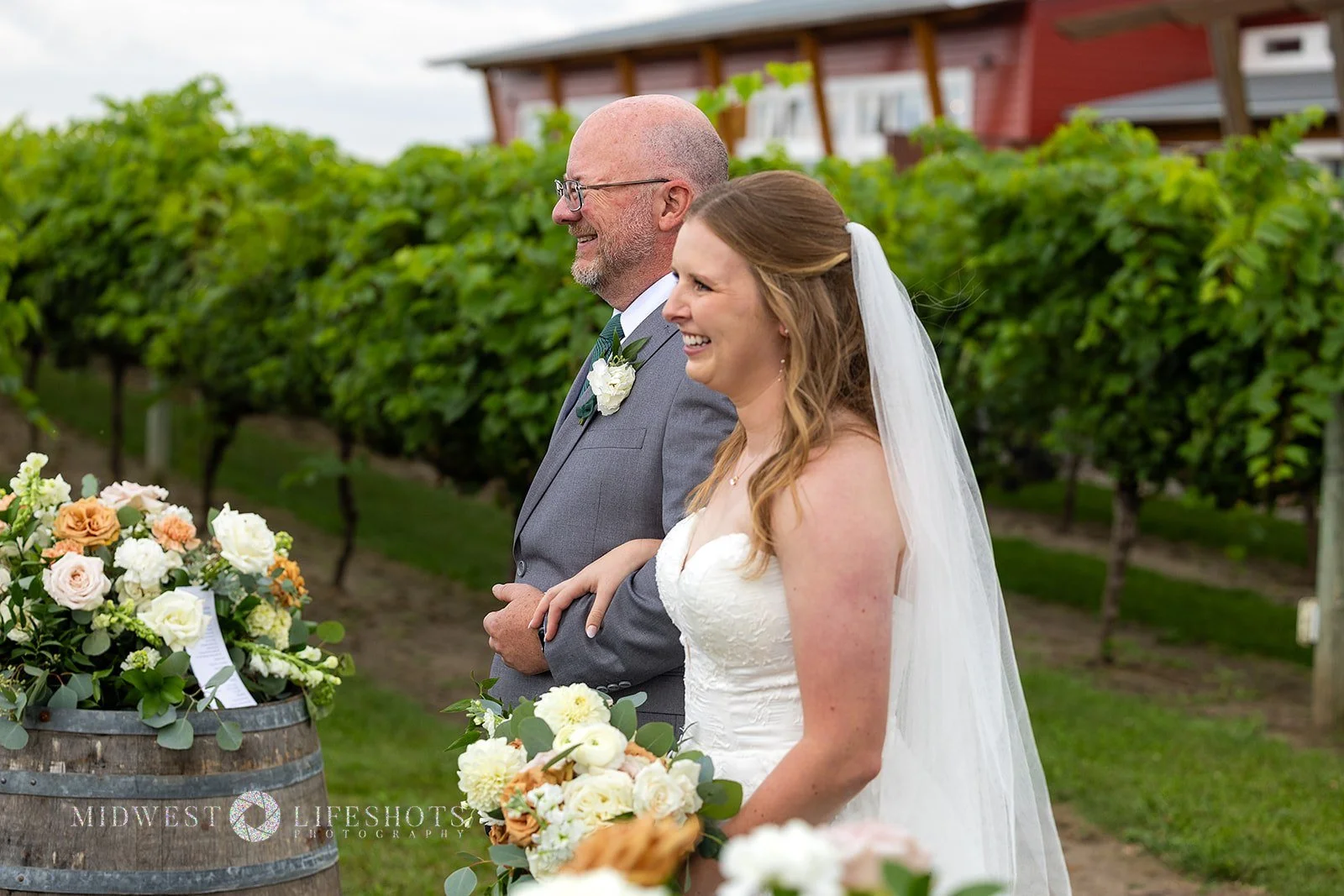 Four Daughters Vineyard & Winery wedding featuring lush creamy whites, soft pinks, and unexpected brown blooms, with romantic wedding florals in Spring Valley, MN.