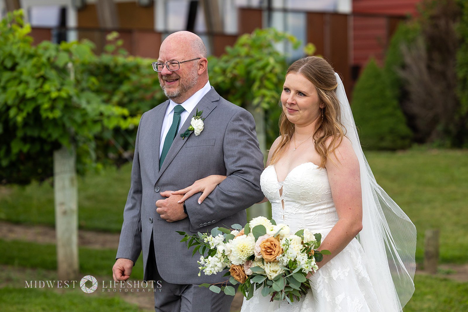 Romantic Spring Valley, MN wedding flowers featuring a modern white bridal bouquet, lush greenery, statement blooms, and garden-inspired ceremony florals.