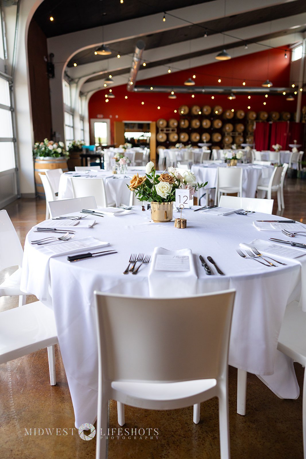 Four Daughters Vineyard & Winery wedding featuring modern, garden-inspired wedding florals, lush greenery, statement blooms, and romantic floral details in Spring Valley, MN.