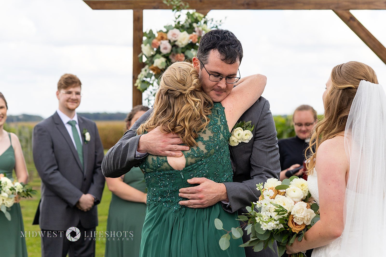 Four Daughters Vineyard & Winery wedding featuring lush creamy whites, soft pinks, and unexpected brown blooms, with romantic wedding florals in Spring Valley, MN.