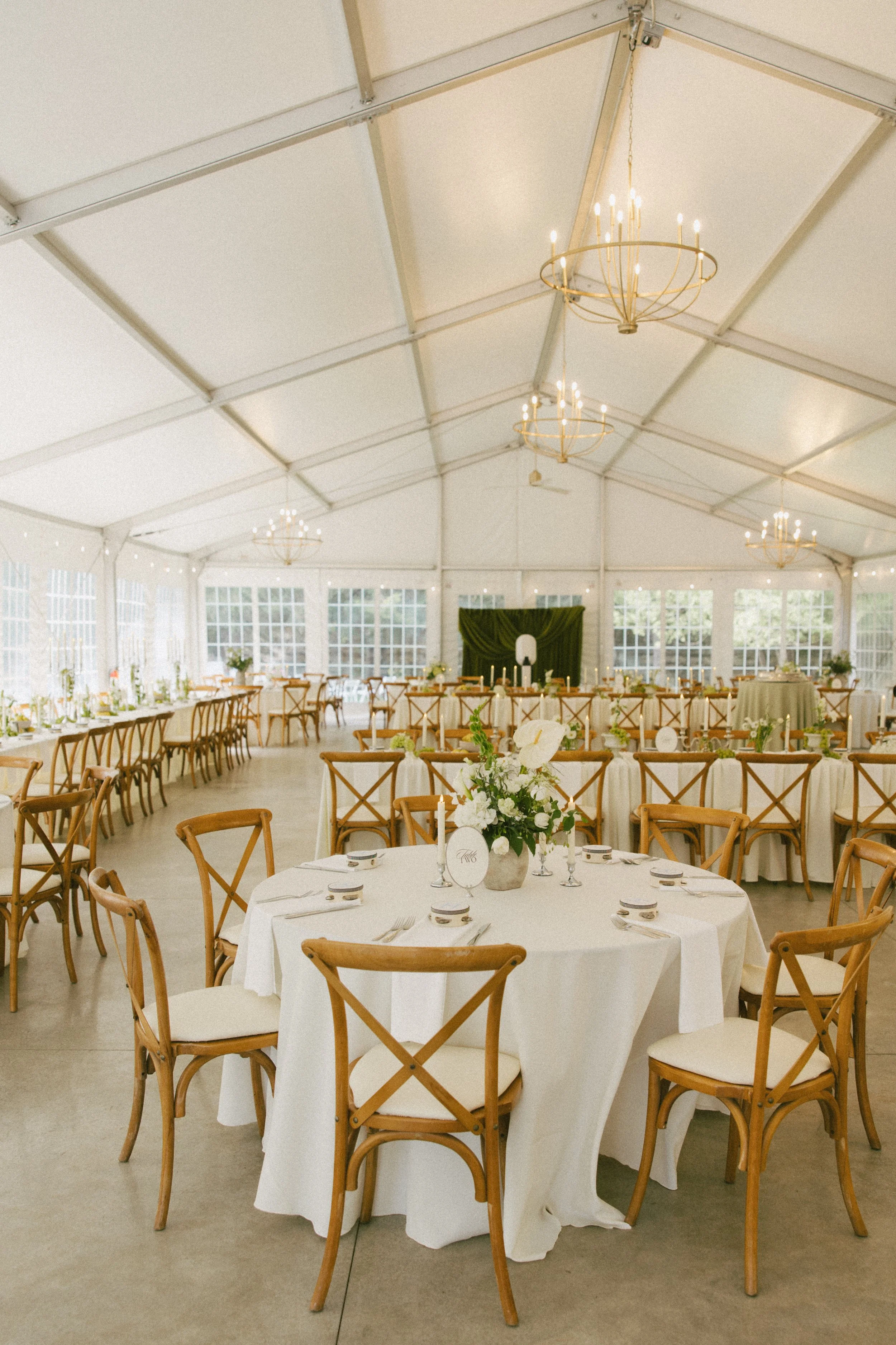 This Hilltop House wedding in Rochester, Minnesota was all about the details: airy garden-inspired florals, old-world candlelight, soft white linens, and those gorgeous little clusters of green grapes winding their way down the table.