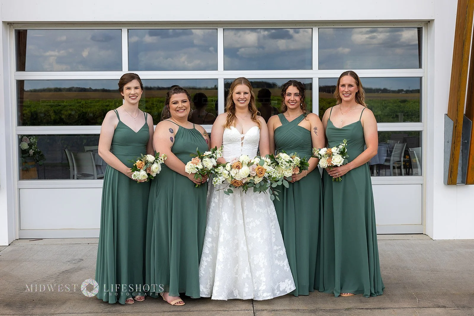 Four Daughters Vineyard & Winery wedding featuring modern, garden-inspired wedding florals, lush greenery, statement blooms, and romantic floral details in Spring Valley, MN.
