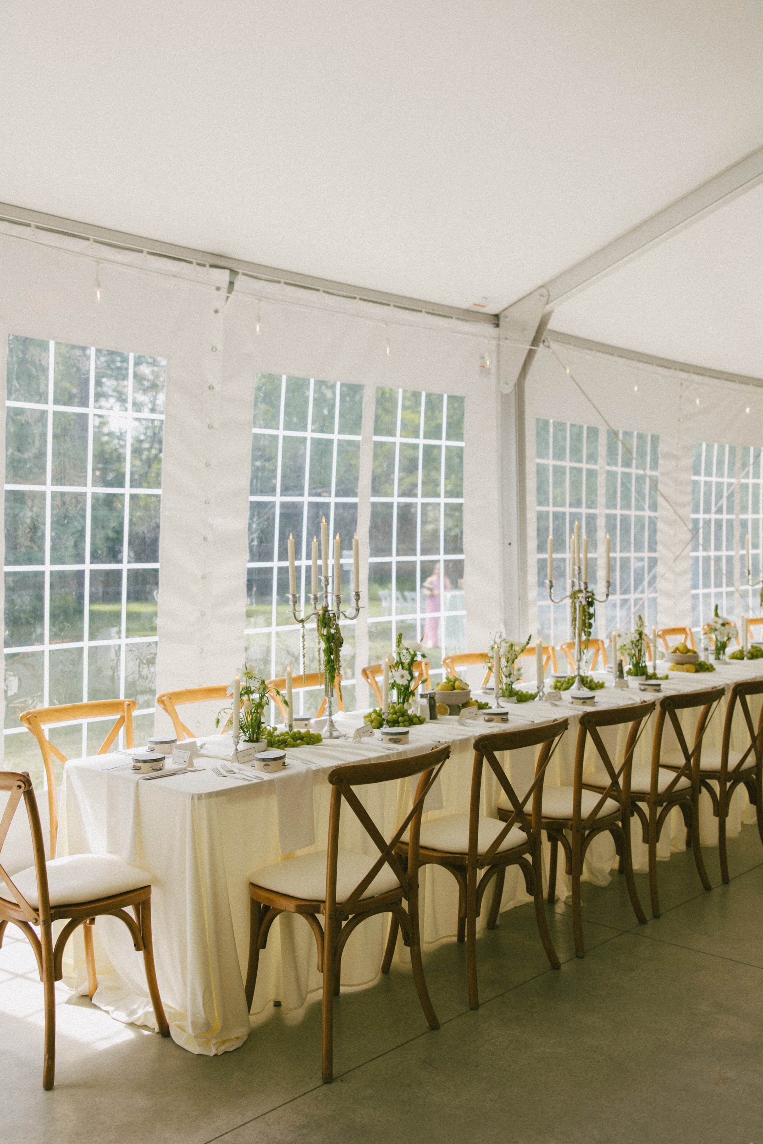 This Hilltop House wedding in Rochester, Minnesota was all about the details: airy garden-inspired florals, old-world candlelight, soft white linens, and those gorgeous little clusters of green grapes winding their way down the table.