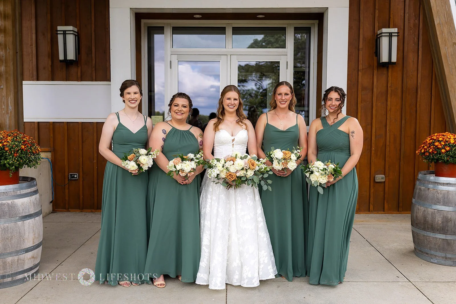 Four Daughters Vineyard & Winery wedding featuring lush creamy whites, soft pinks, and unexpected brown blooms, with romantic wedding florals in Spring Valley, MN.