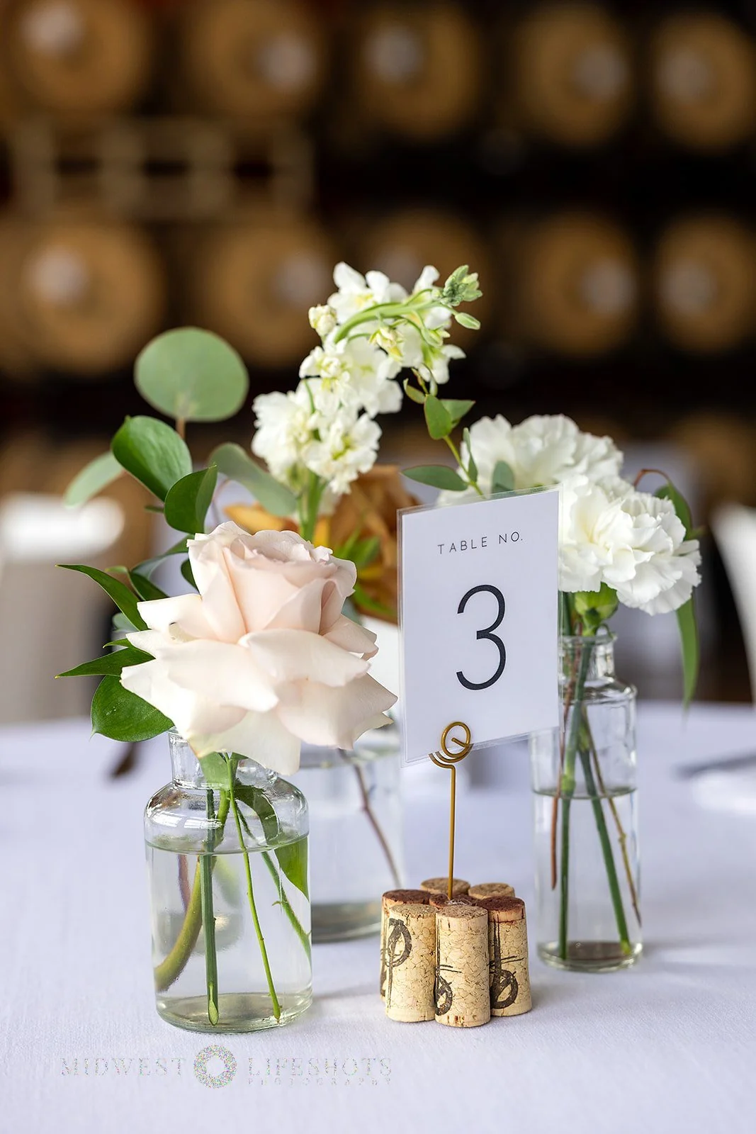 Four Daughters Vineyard & Winery wedding featuring modern, garden-inspired wedding florals, lush greenery, statement blooms, and romantic floral details in Spring Valley, MN.
