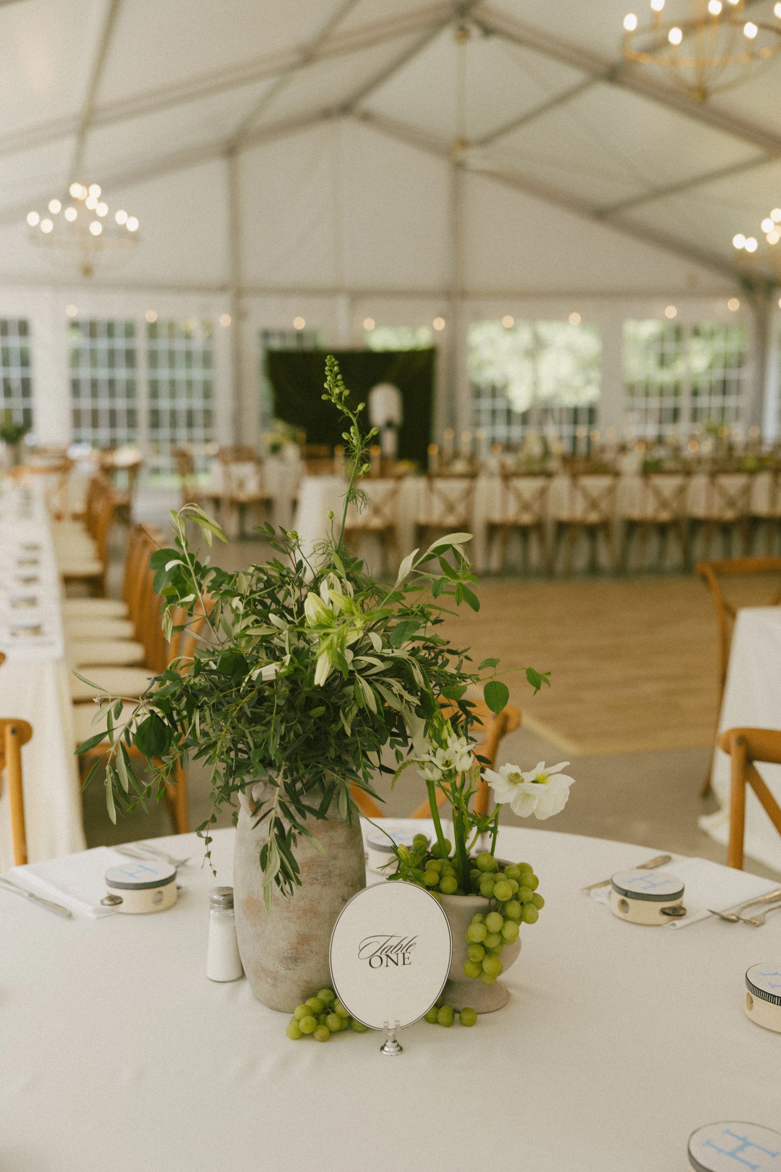 Romantic Rochester, MN wedding flowers featuring a modern white bridal bouquet, lush greenery, statement blooms, and garden-inspired ceremony florals.