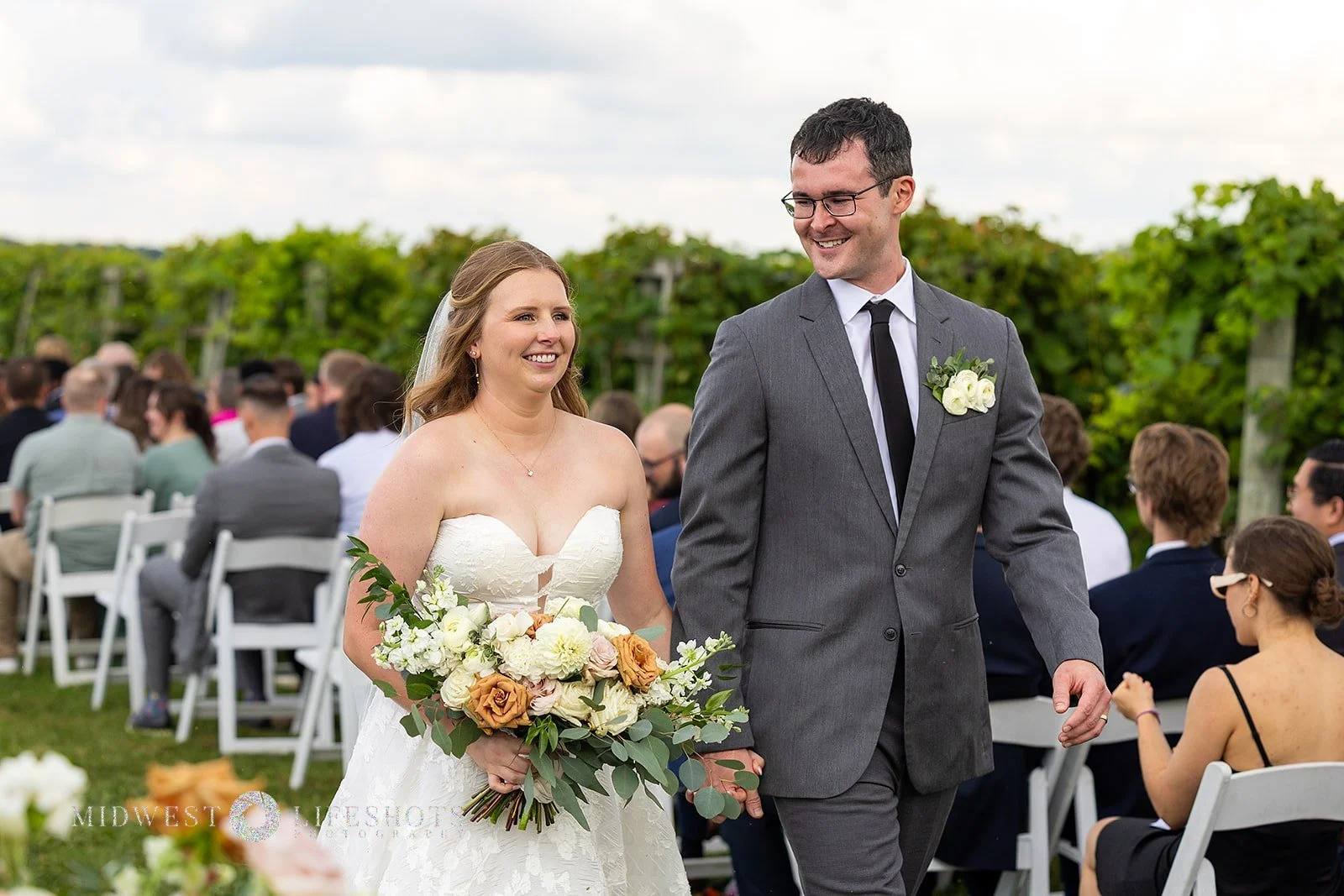 Romantic Spring Valley, MN wedding flowers screams quiet luxury - subtle statement florals on an arch at Four Daughter's Winery