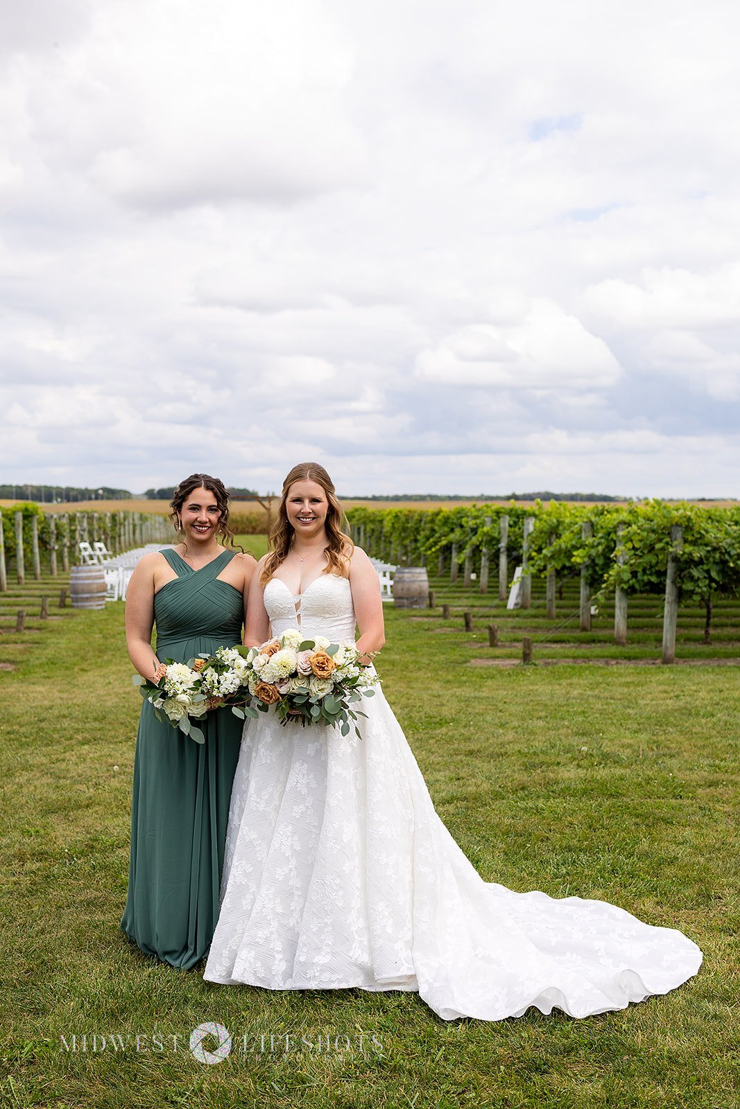 Four Daughters Vineyard & Winery wedding featuring lush creamy whites, soft pinks, and unexpected brown blooms, with romantic wedding florals in Spring Valley, MN.