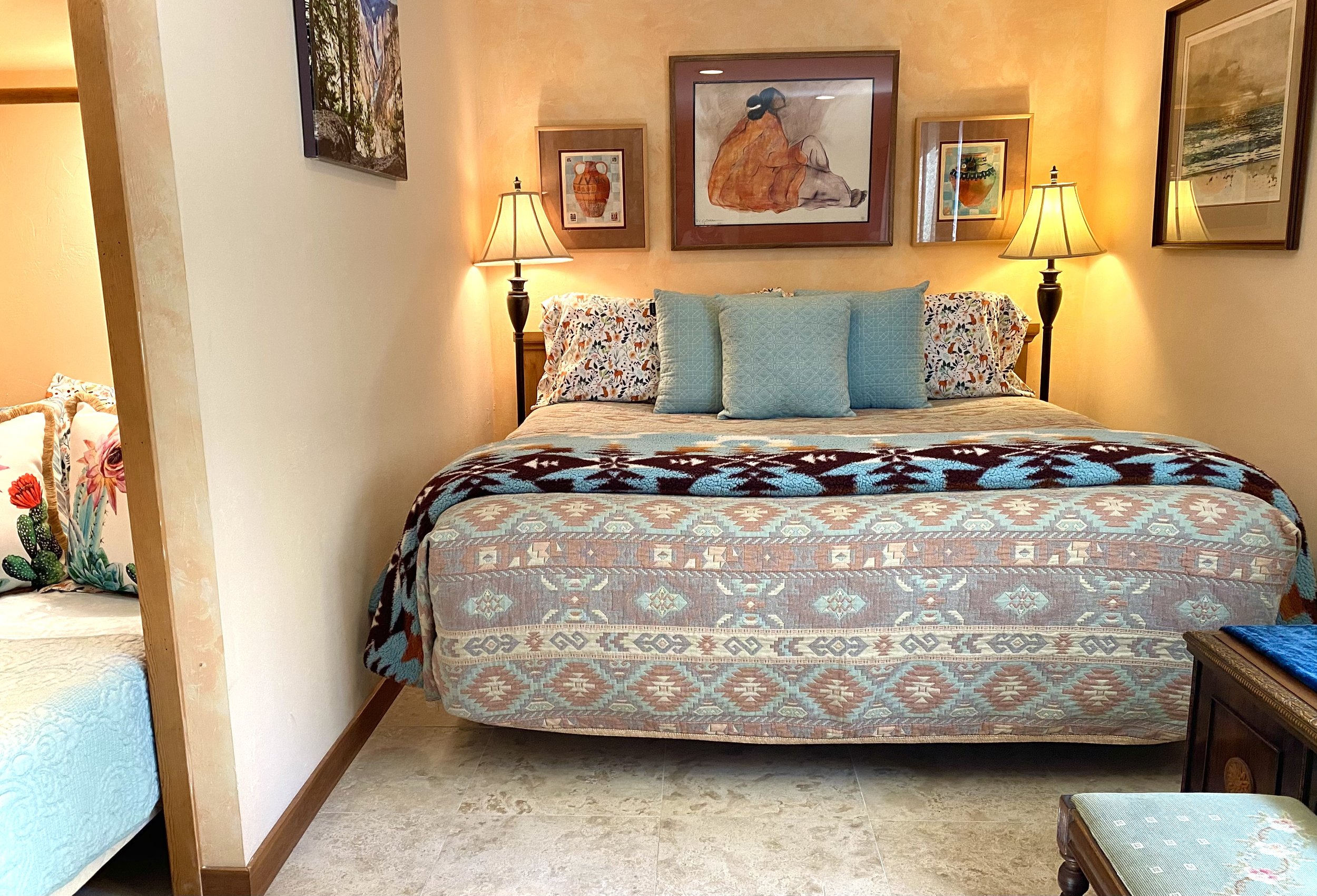 A Southwestern style bedroom with cozy lighting.