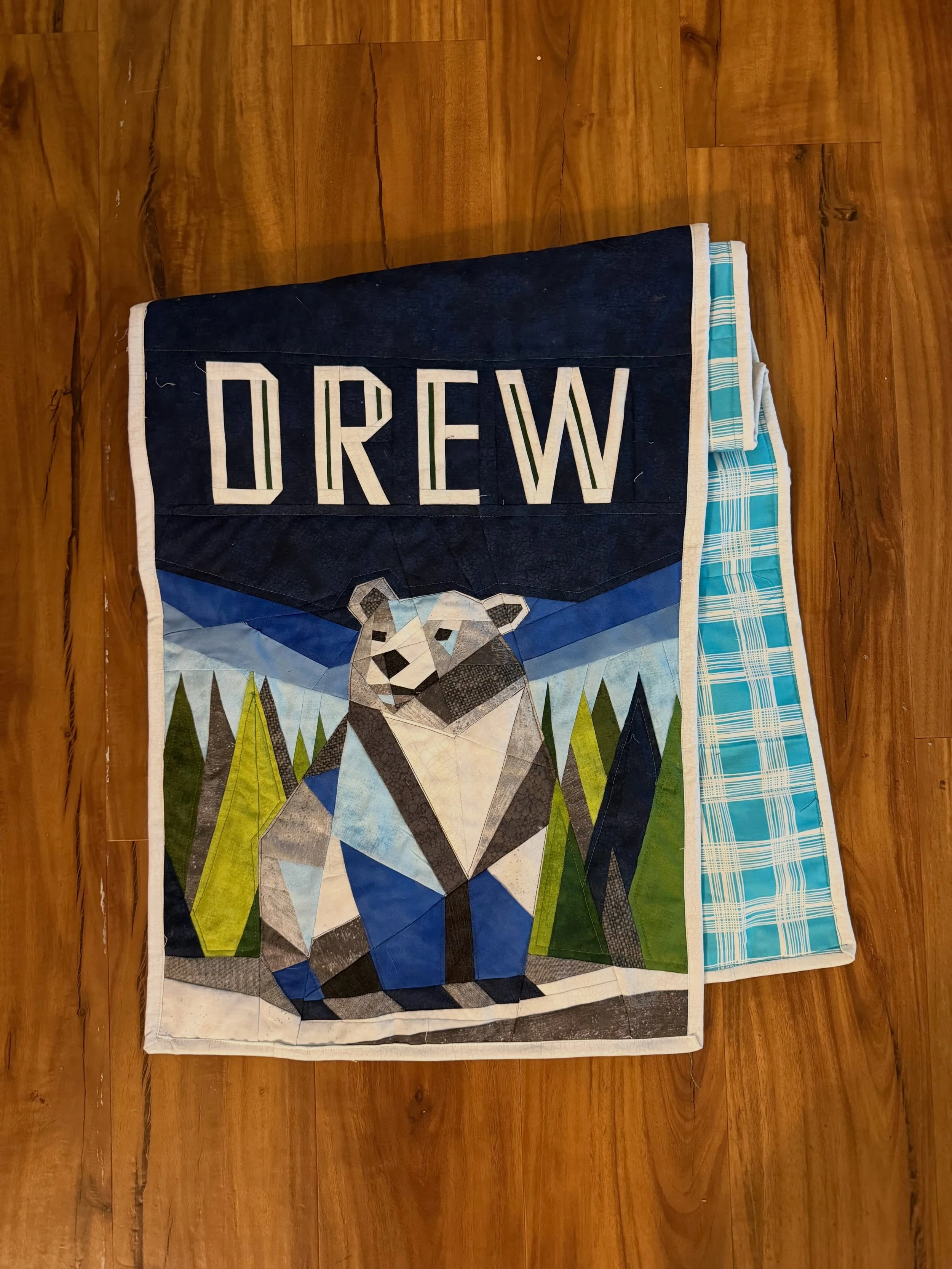 Quilted and bound before I leave for @usafencing Summer Nationals! Just need to wash and dry.

It&rsquo;s a hanging sign for folding tables for @drewfencing when their coach @josephzanko goes to admission fairs. 

All of the fabrics except for the tu