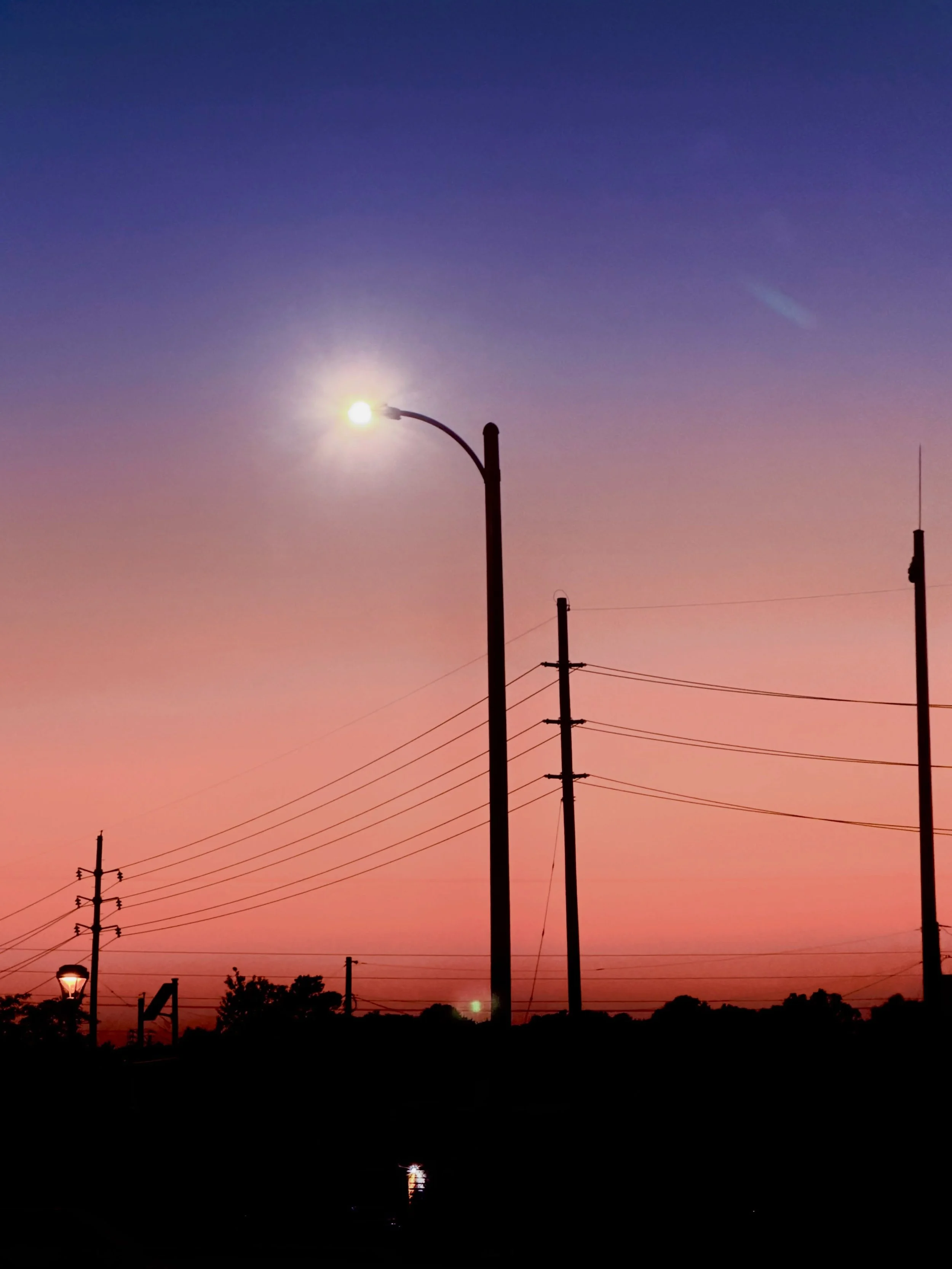 Sometimes all it takes to make you happy is a summer sunset and telephone poles after work.