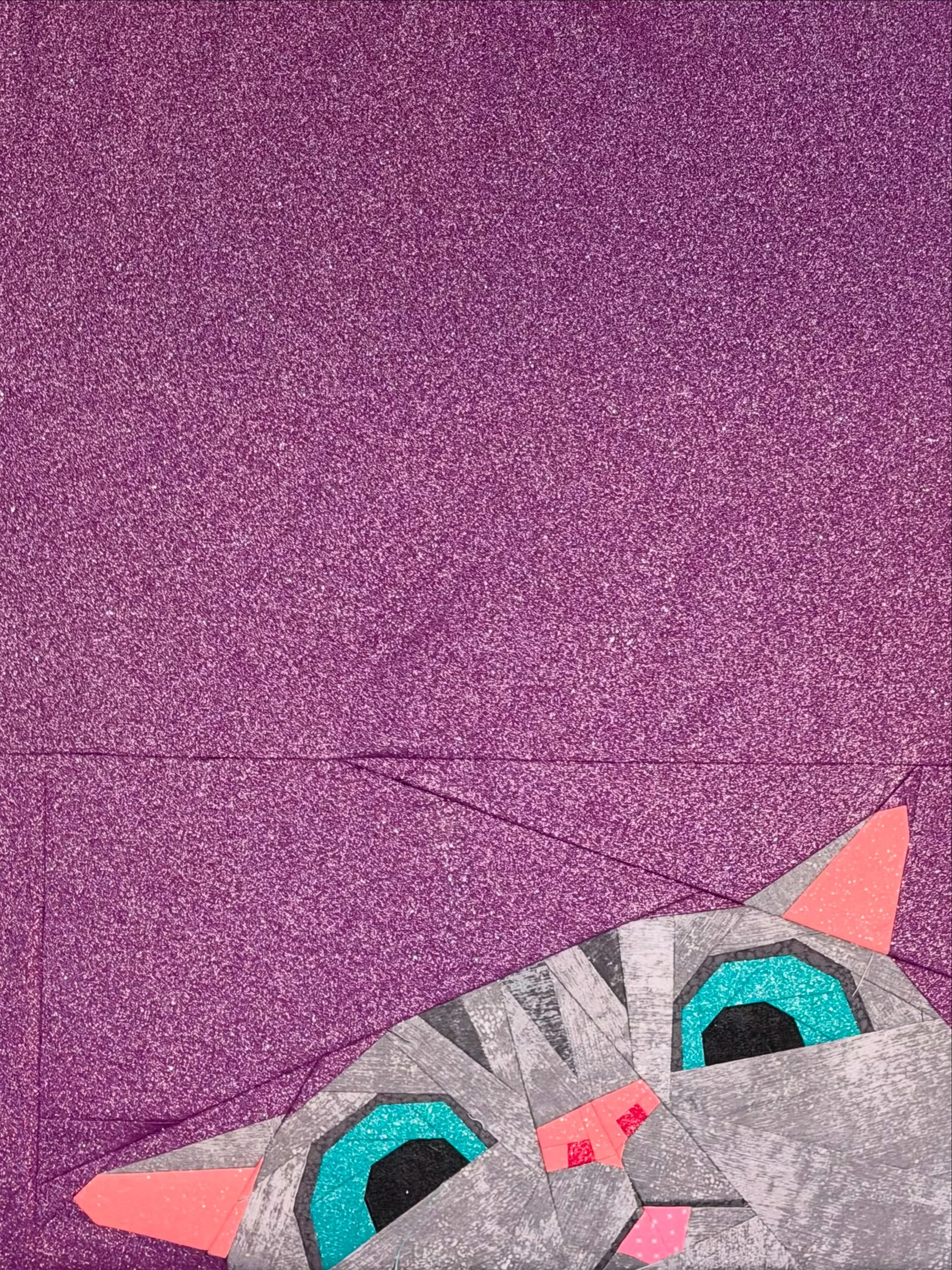 Made some art for above our TV.

Pattern: Corner Cat by @littletinypiranha 
Fabrics: all from stash. I used up all my purple Singer glitter fabric. RIP Joann - that was where I got a lot of my glitter solid fabric and I&rsquo;m starting to run out.