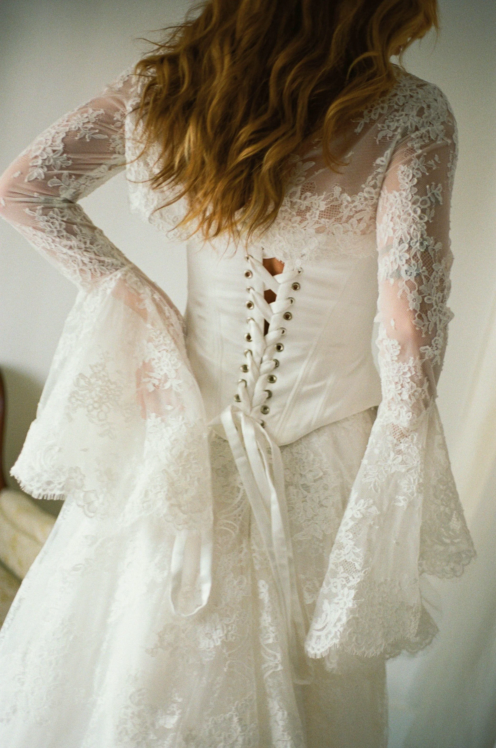 This chic three-piece gown features a structured satin corset, an intricately crafted lace skirt, and a detachable bolero for added versatility. Effortlessly blending modern sophistication with timeless elegance, this interchangeable design allows yo