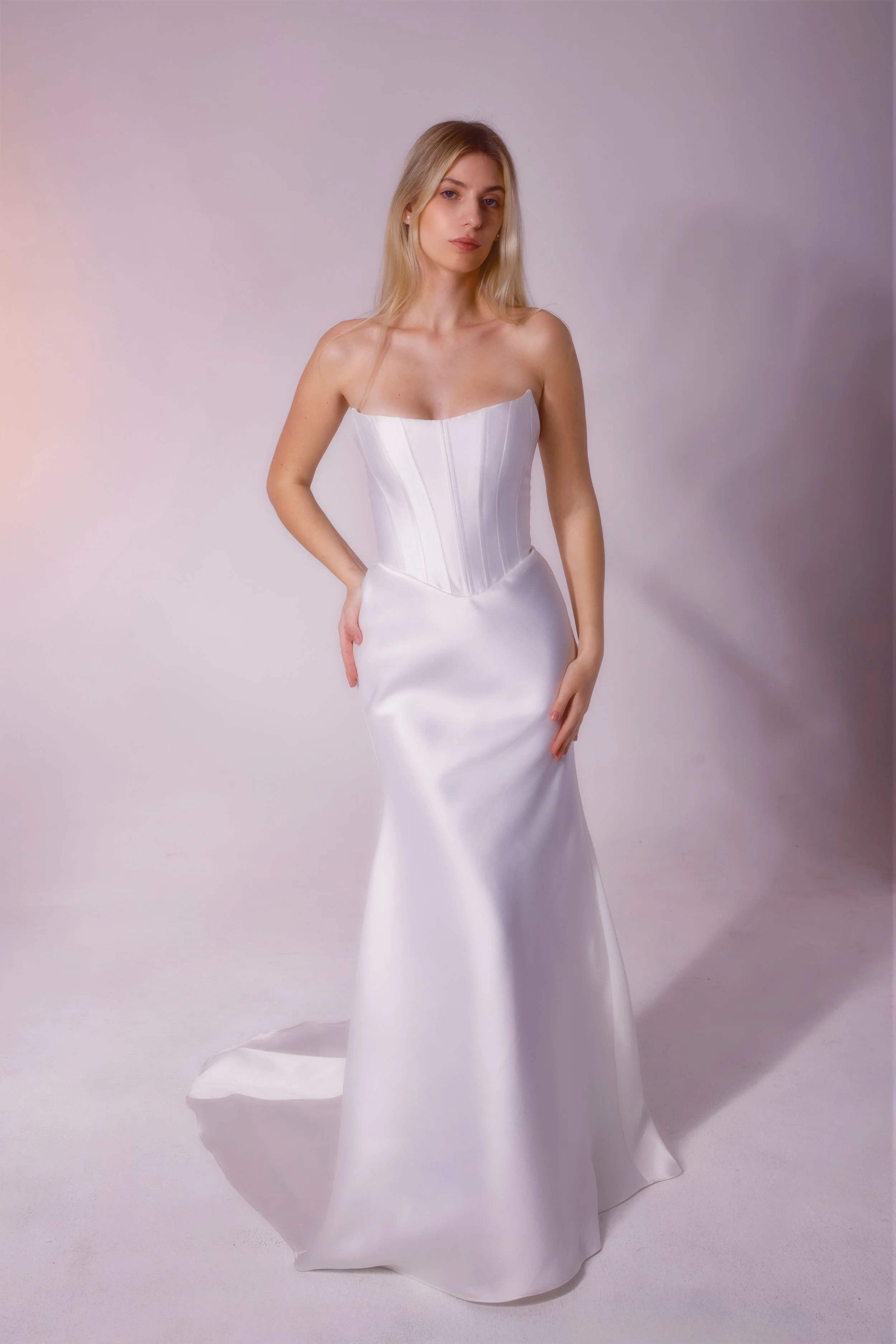 Mikado fabric dress featuring a corset-shaped top with built-in boning, cateye detailing, and a fitted skirt for a structured, elegant silhouette.