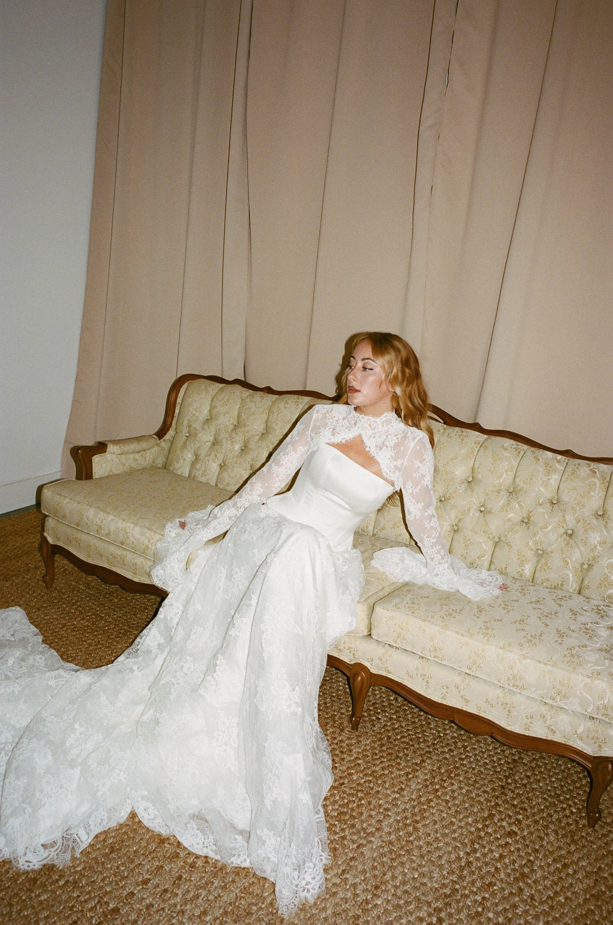 This chic three-piece gown features a structured satin corset, an intricately crafted lace skirt, and a detachable bolero for added versatility. Effortlessly blending modern sophistication with timeless elegance, this interchangeable design allows yo