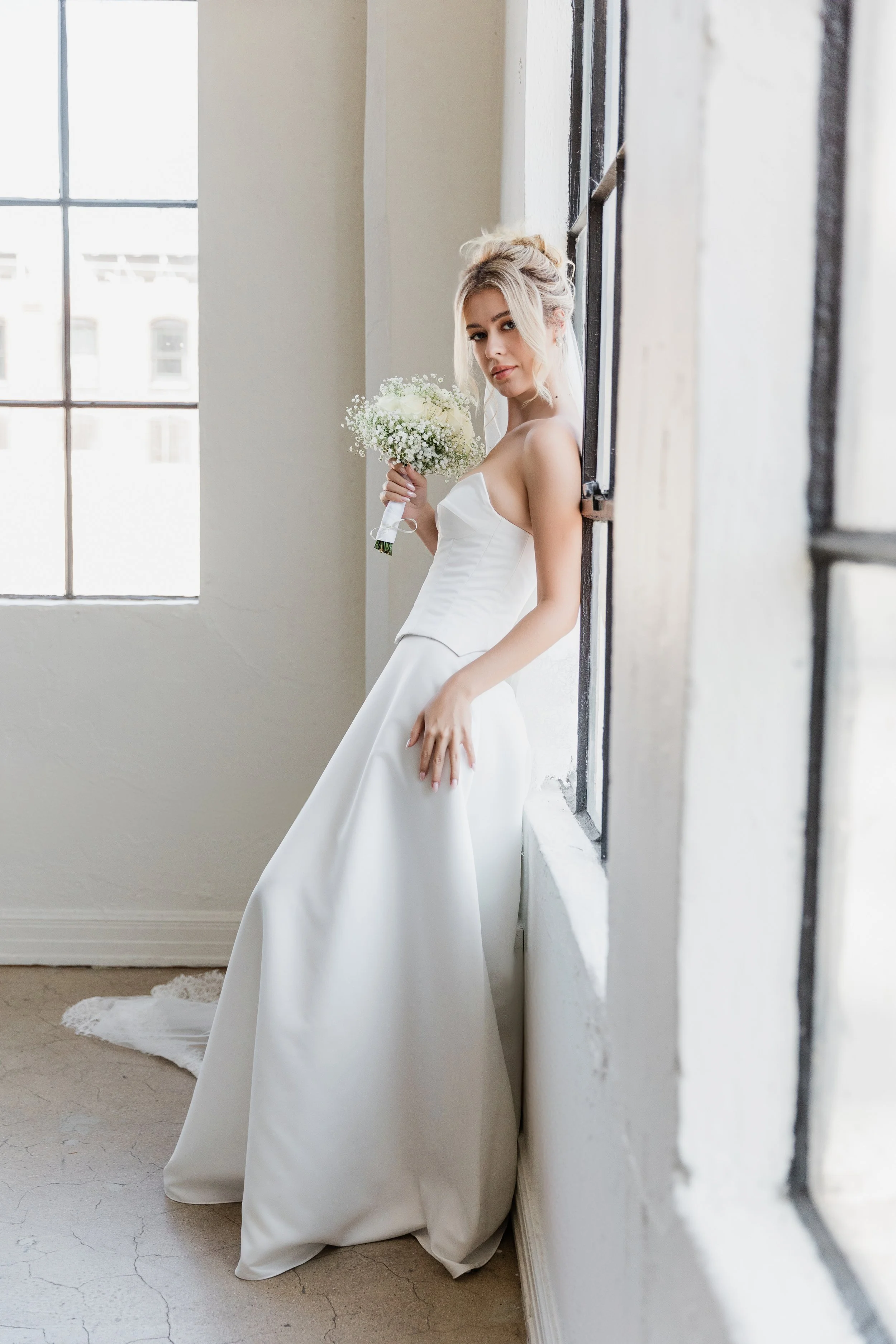 Beautiful two-piece satin gown. A-line skirt with  a structured bodice. Timeless meets modern style!
