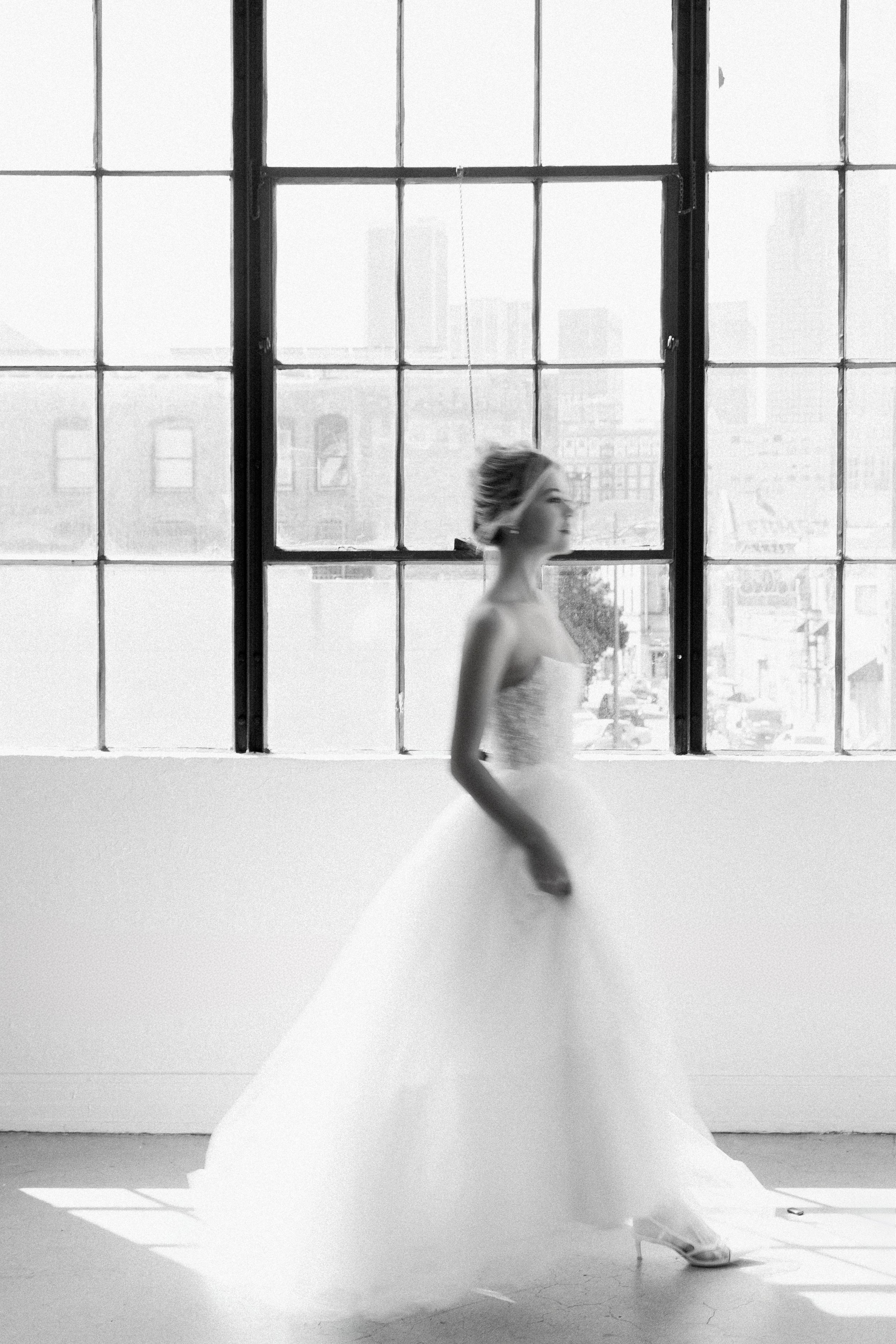 Gown "Nimbus" is crafted from intricately beaded embellished fabric, layered with soft organza and airy tulle. Featuring a flattering waistline and a structured, boned bodice, this gown beautifully blends a fairytale silhouette with contemporary eleg