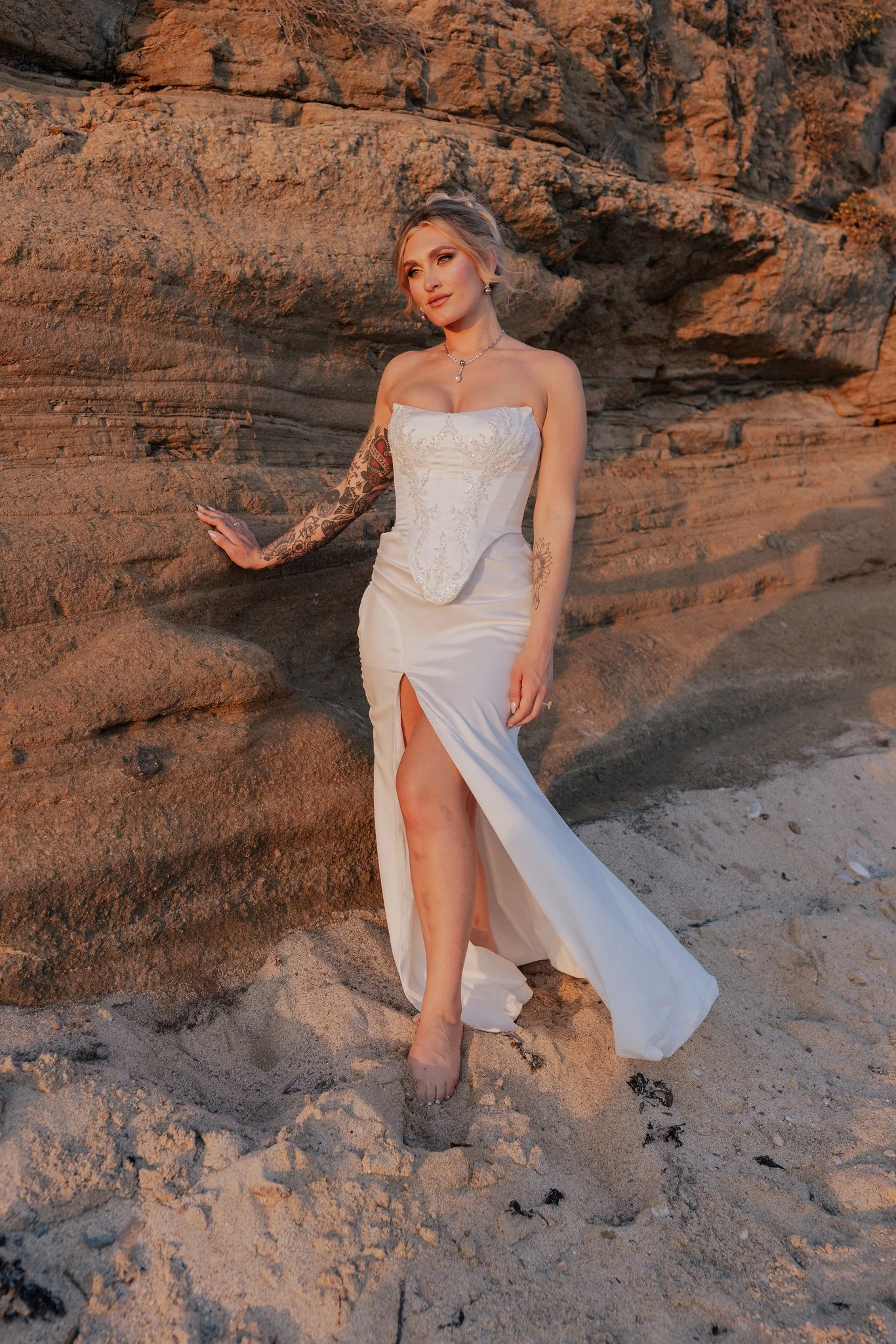 A hand-beaded corset paired with interchangeable ivory satin skirts—choose from a fitted silhouette, a classic ballgown, or a playful mini. The perfect dress to take you from your ceremony to the reception and straight into the after-party, all in on