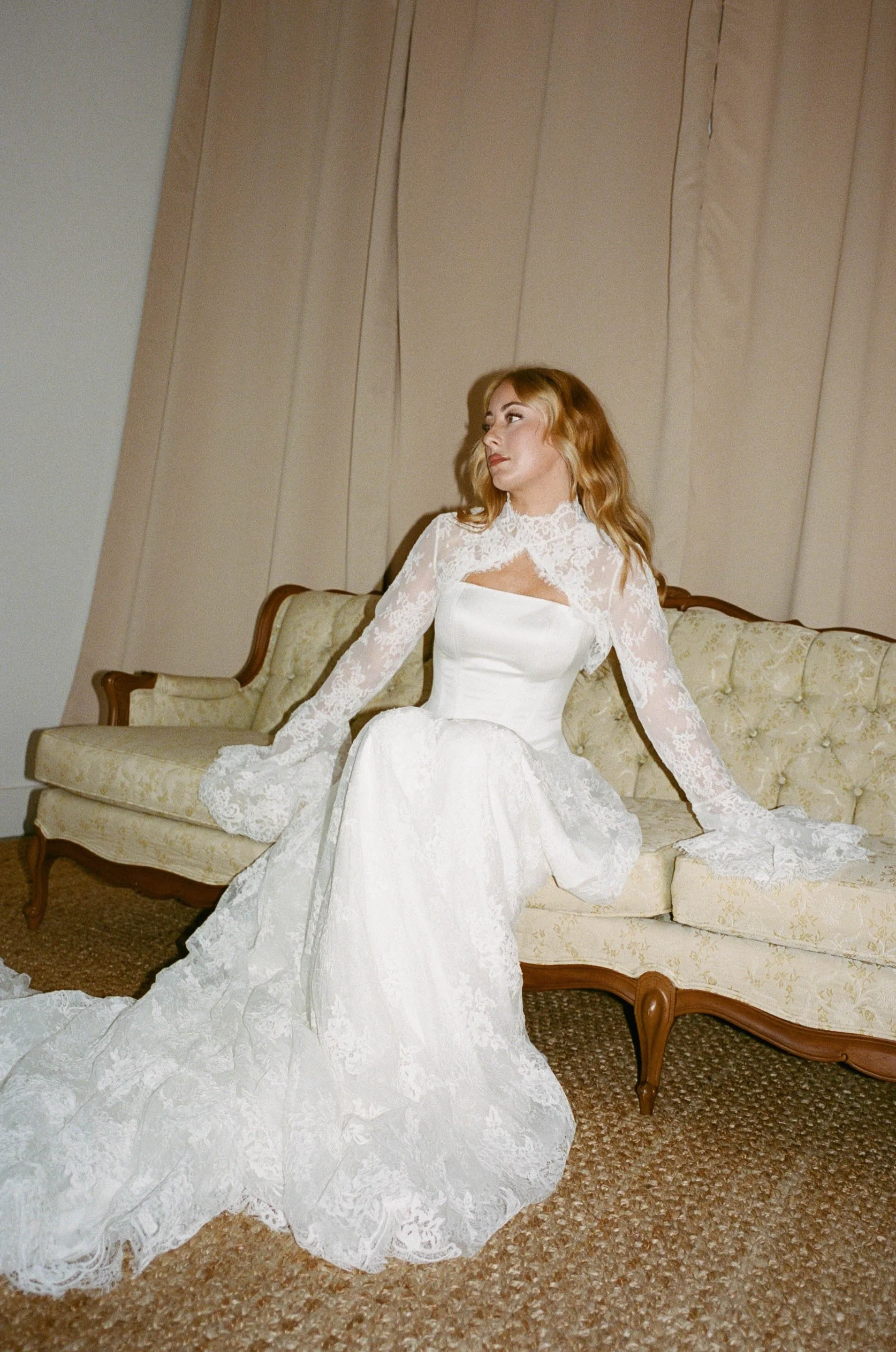 This chic three-piece gown features a structured satin corset, an intricately crafted lace skirt, and a detachable bolero for added versatility. Effortlessly blending modern sophistication with timeless elegance, this interchangeable design allows yo