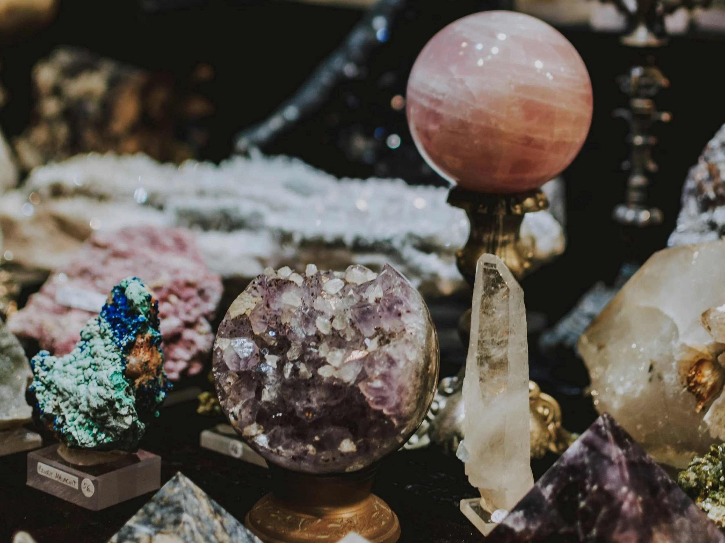 Photo of various crystals on display by lilartsy on Unsplash