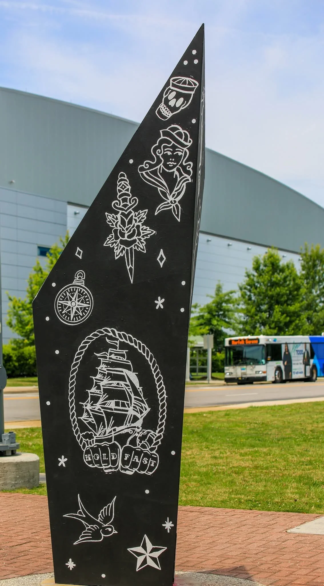 Navy-themed side of Rebecca Coelho's Virginia Beach mural highlighting the military influence and maritime heritage that help shape the city's identity.