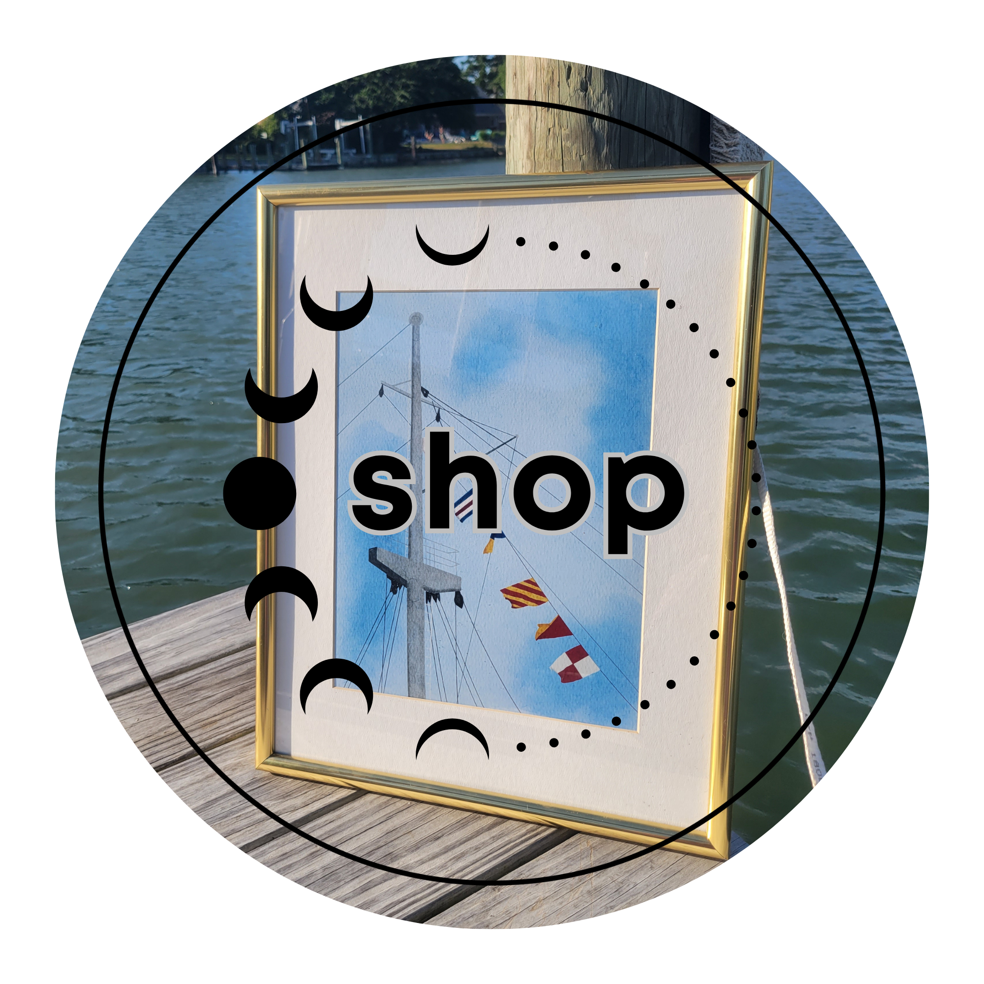 Framed nautical watercolor art print on a dock by the water, with moon phase circle design and "shop" text overlay