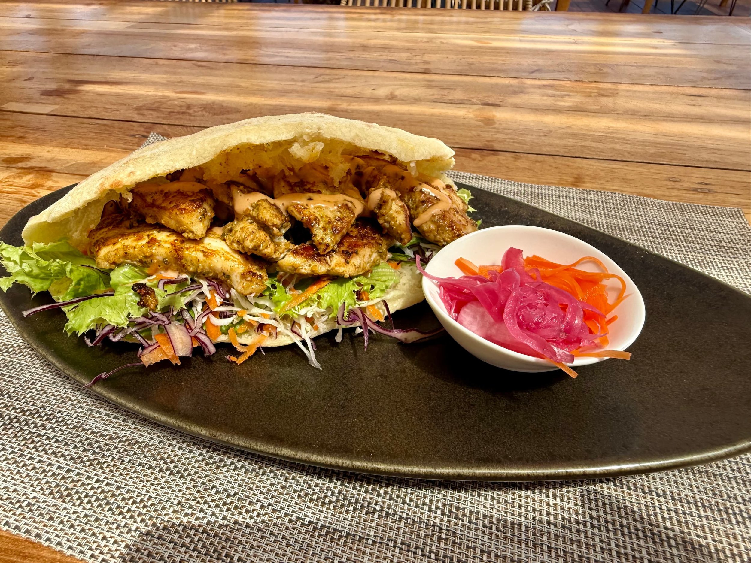 ISLAND FISH SANDWICH ~ grilled local catch, pickled carrots & onions, summer slaw, fresh mint, spicy tamarind mayo