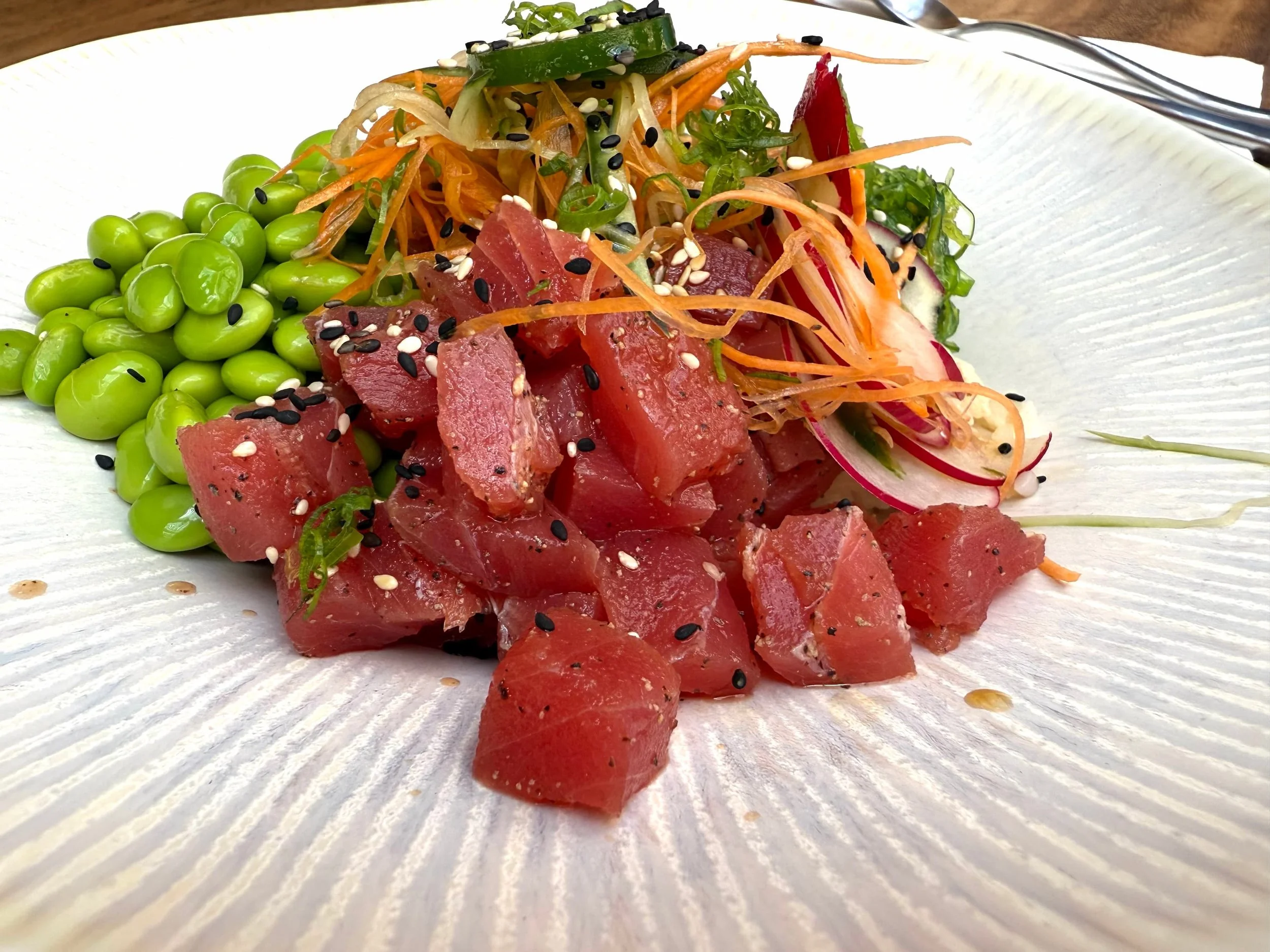 TUNA POKE BOWL ~ yellowfin (ahi) tuna, sushi rice, edamame, wakame, avocado, radish, green onion, sesame soy dressing

