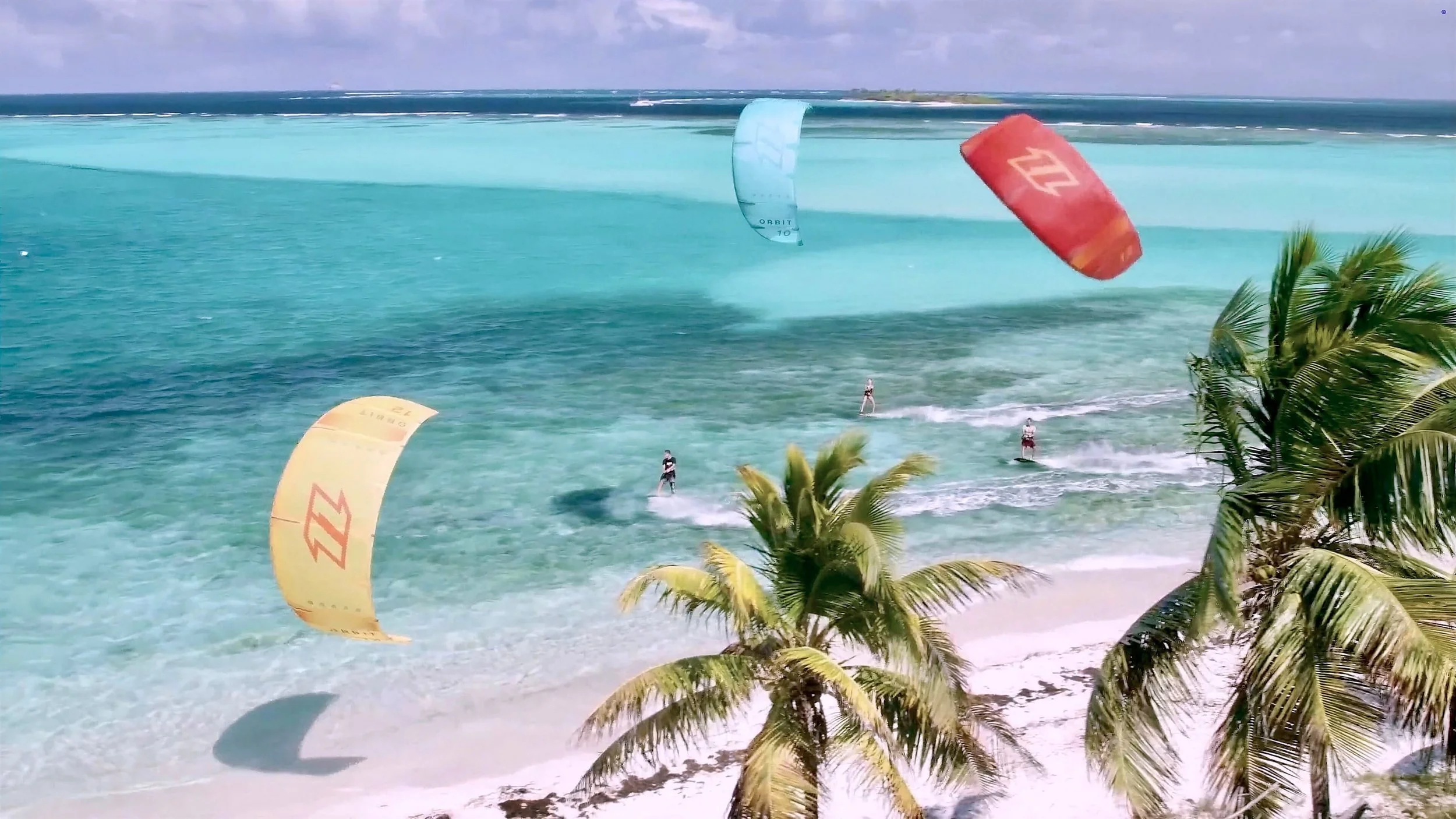 Kiteboarders on the beach in front of the resort