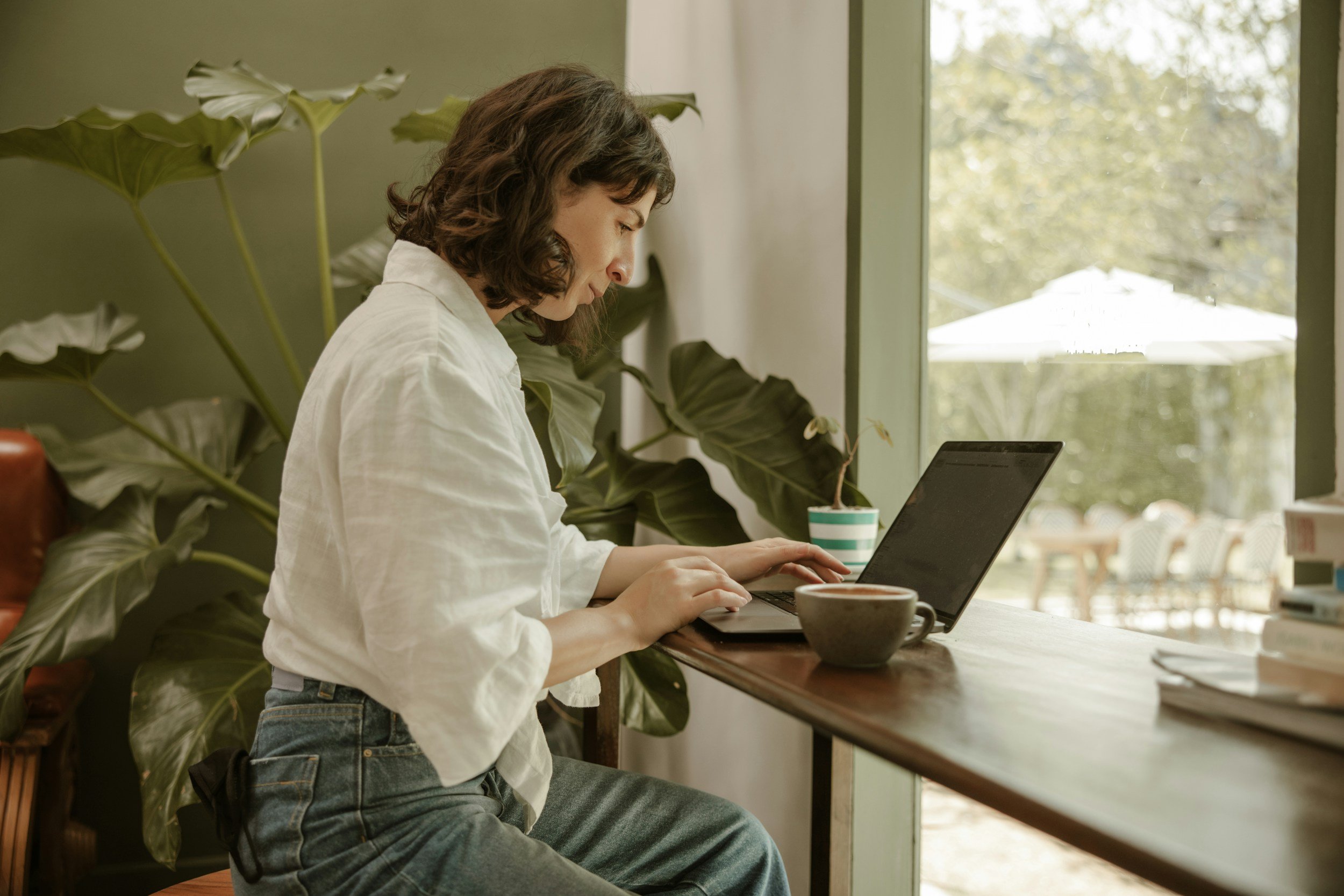 Woman doing online therapy session on laptop at home—flexible virtual therapy in Virginia, Maryland, and DC.