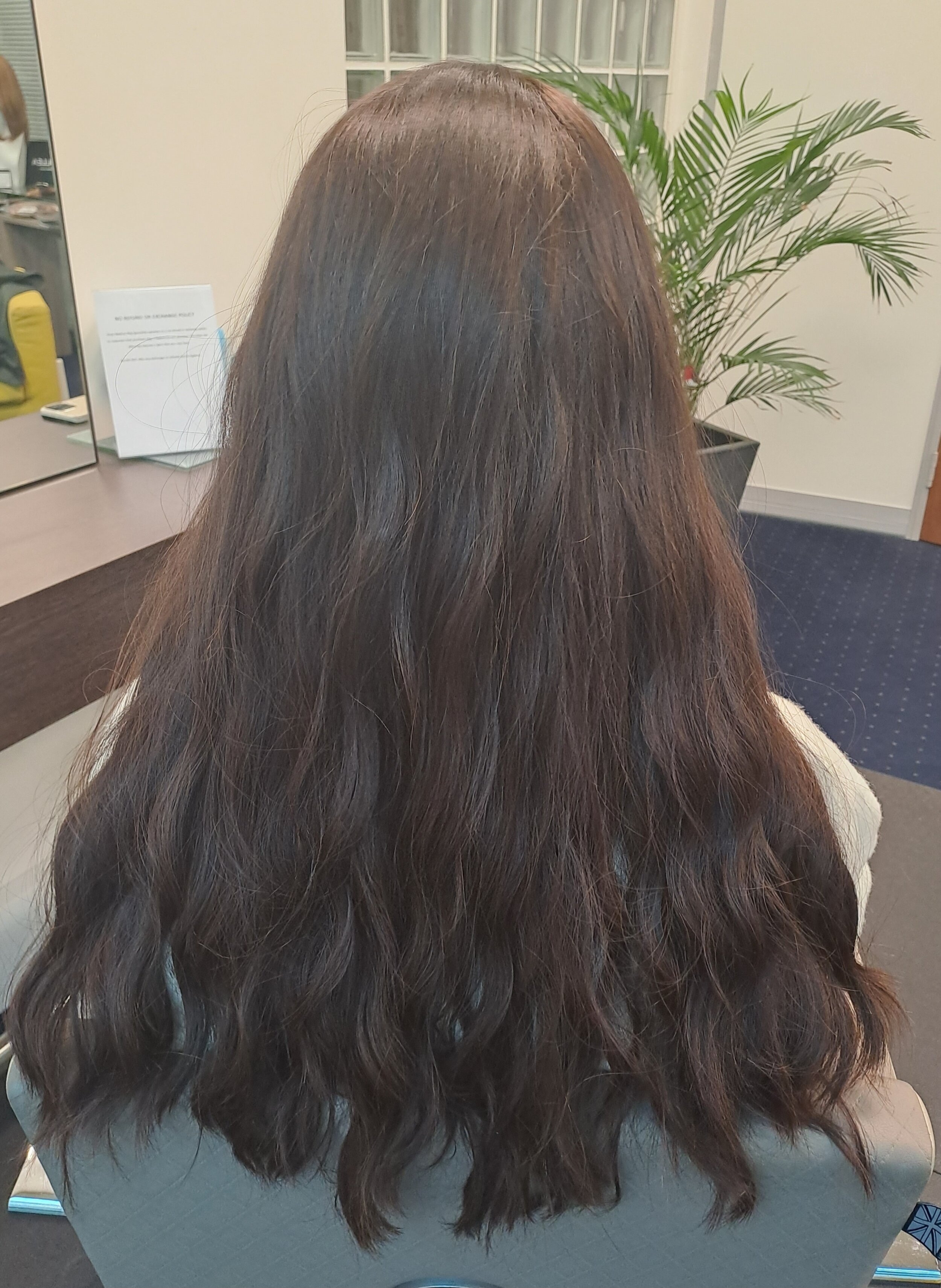 This custom-made wig features exceptional hair quality with a sleek, glossy finish and a subtle wave at the ends for soft texture. Colored in shade #4, a rich deep brown with no red undertones, it offers a natural and elegant look. With a luxurious 2