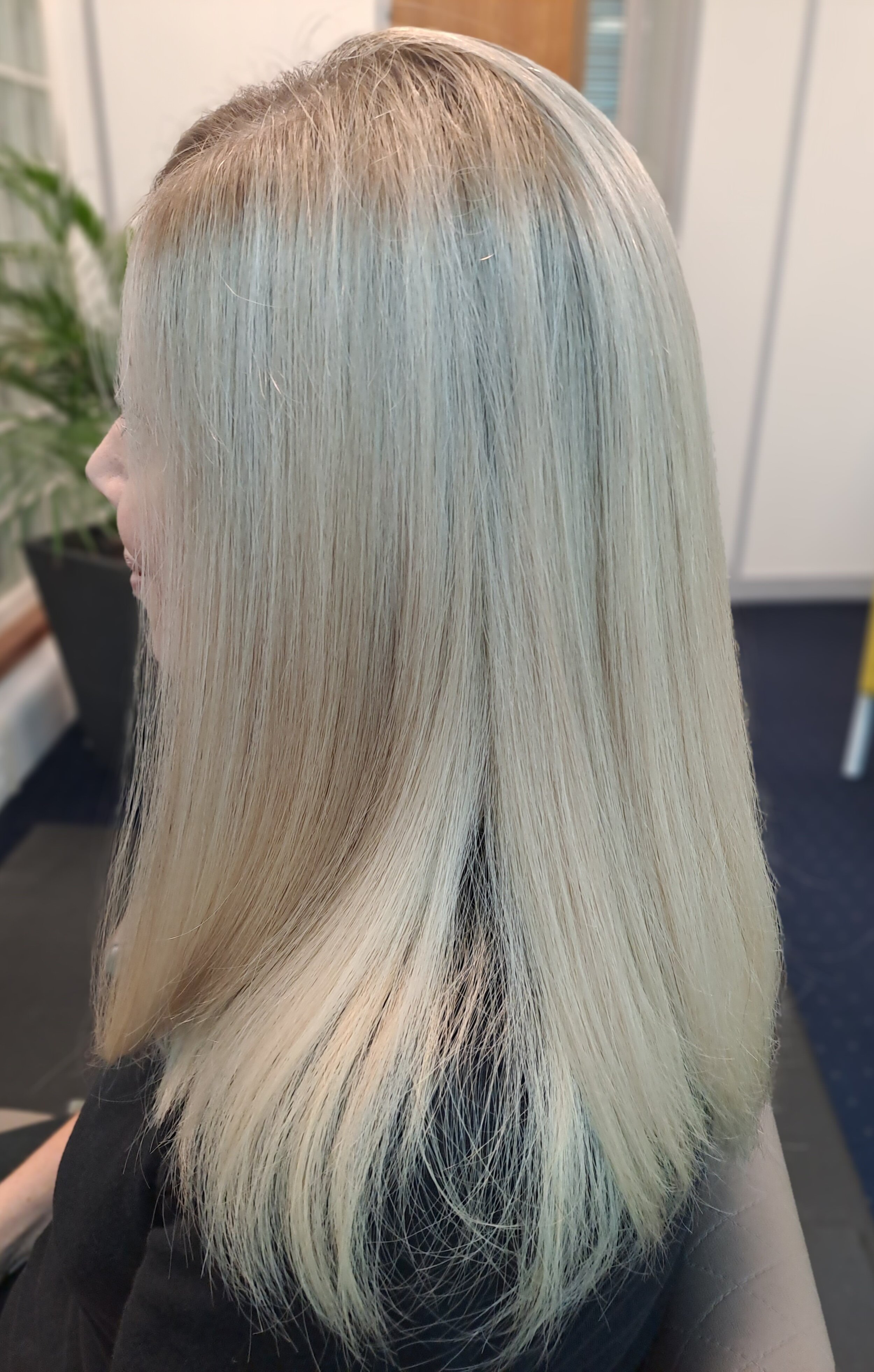 This custom-colored wig features a natural blonde shade with a subtle darkened root, creating a stunning gradient effect that adds depth and dimension. Made from premium quality hair, the expert coloring ensures a flawless, lifelike appearance that’s