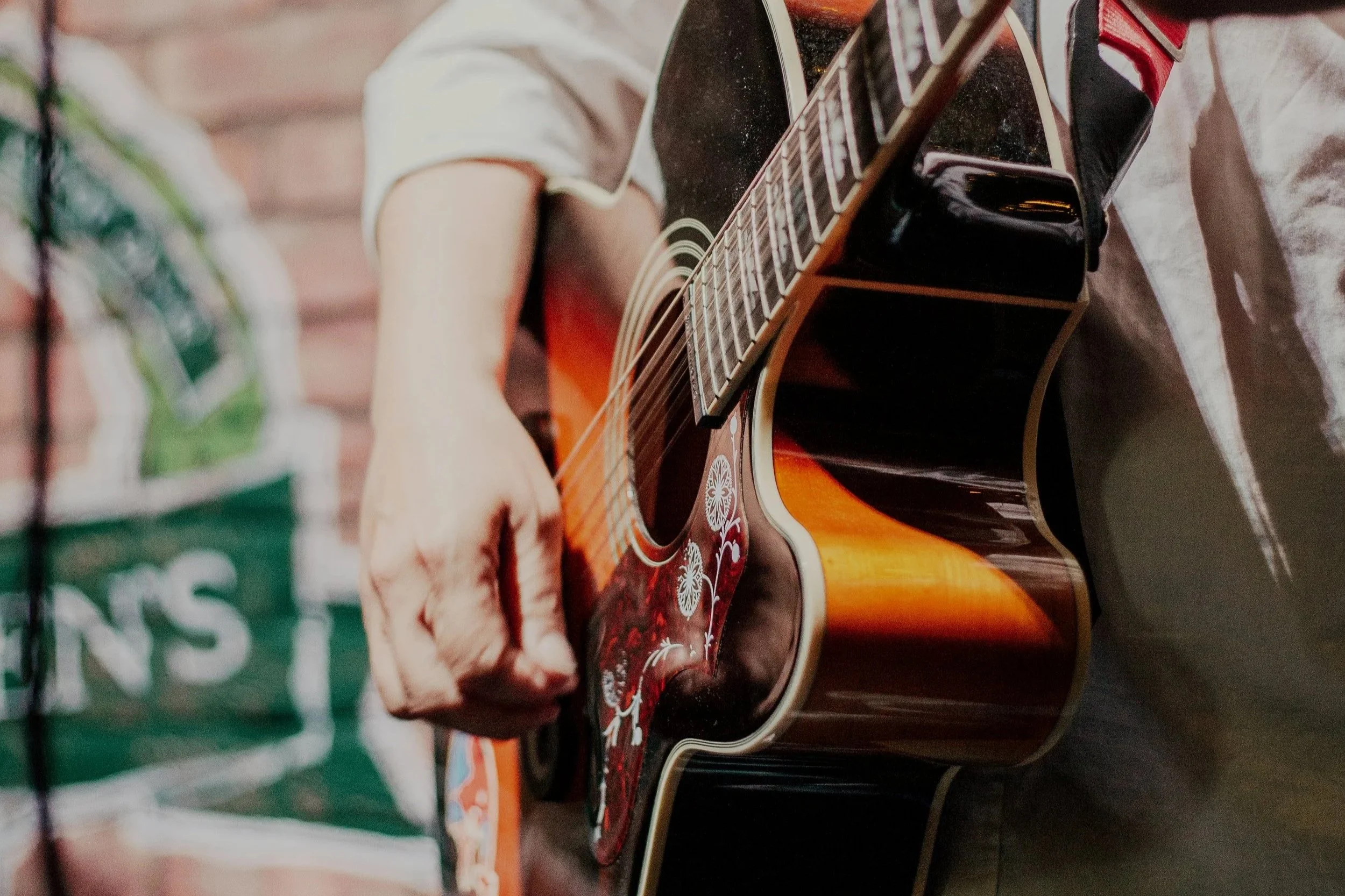 Live singer playing guitar in Irish pub