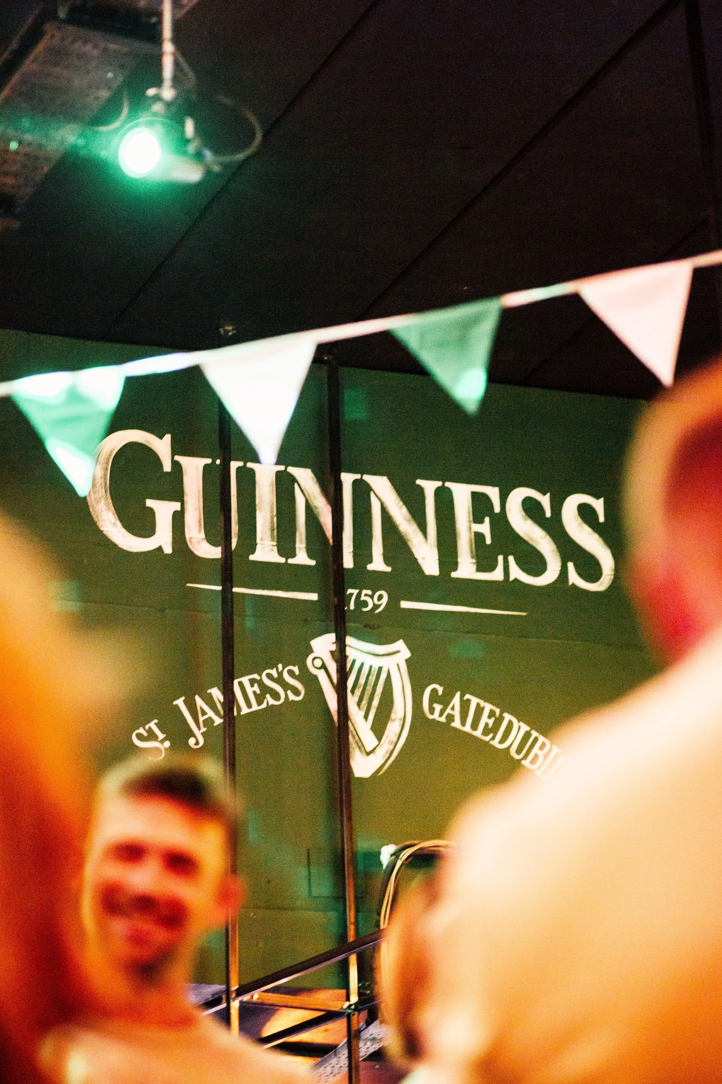 guinness mural painted on wall in irish bar